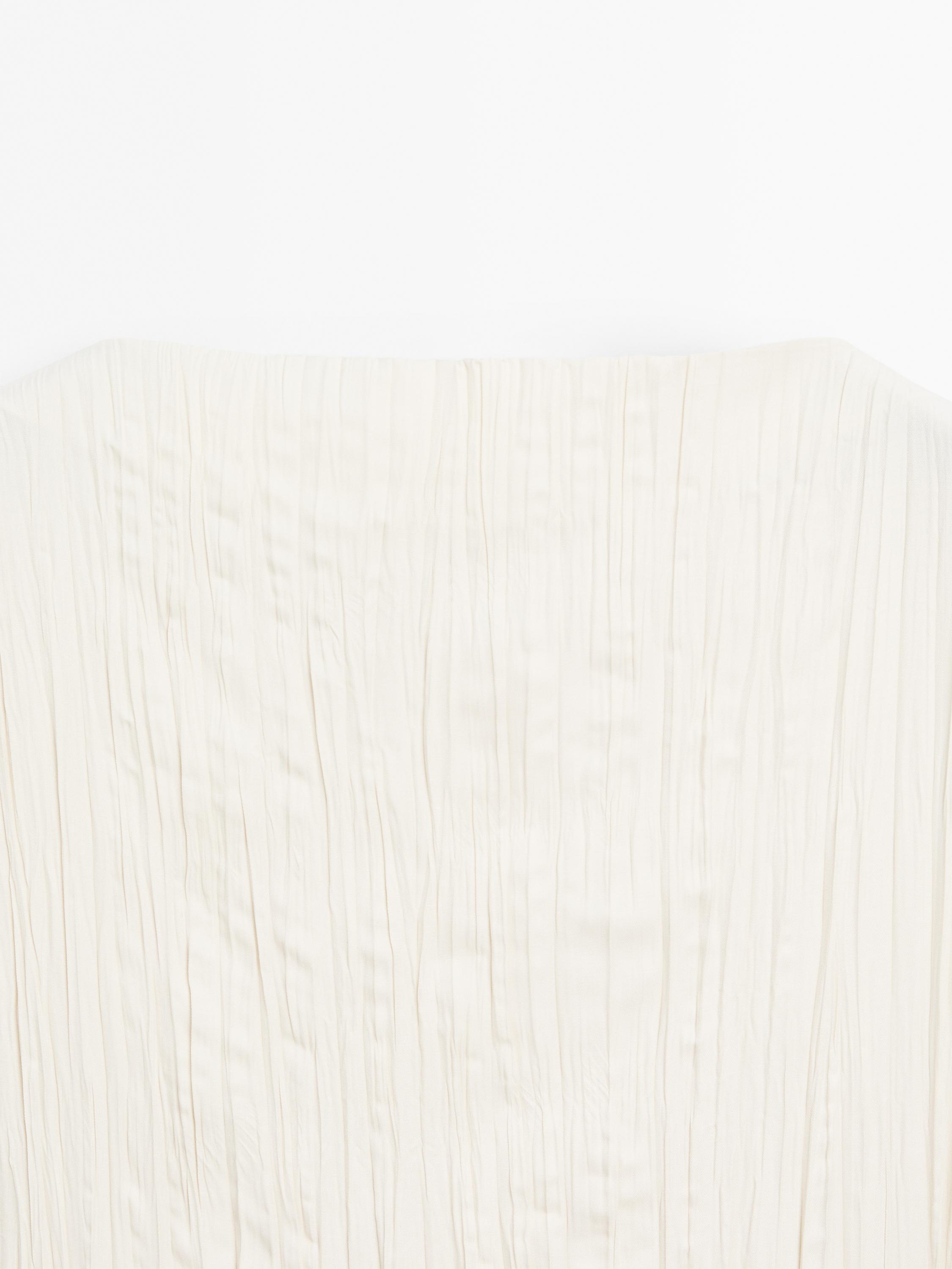 Long dress with godets and pleated detail