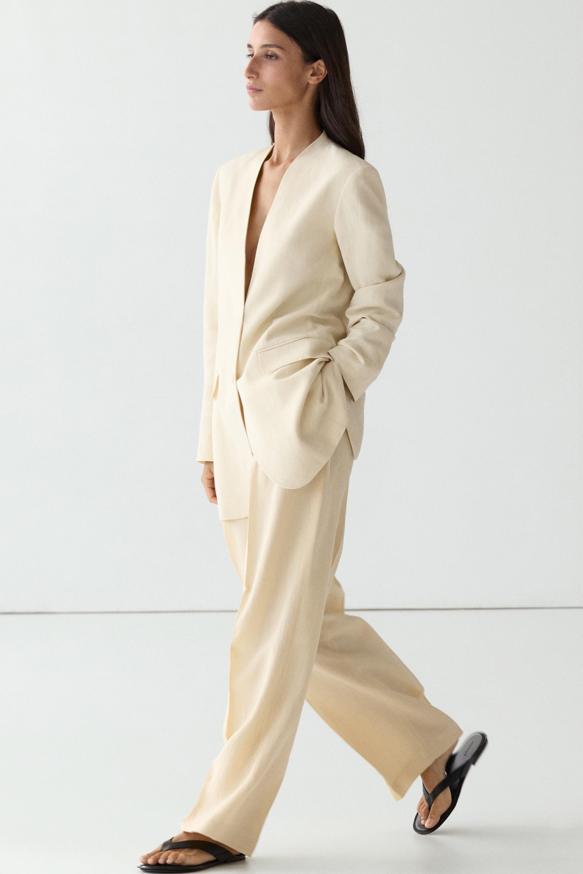 Flowing trousers with pleats — Beige