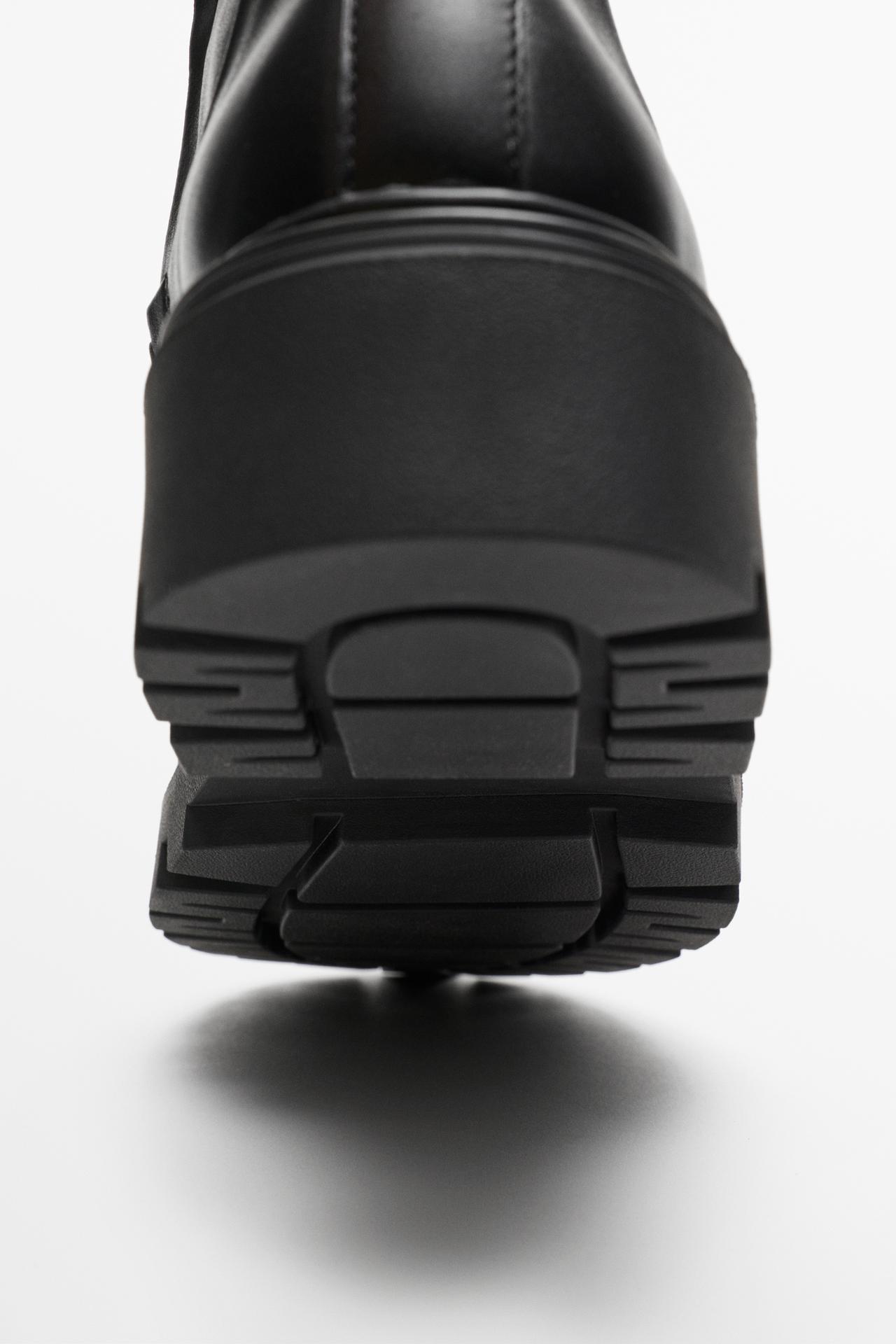 Flat leather ankle boot with track sole — BLACK