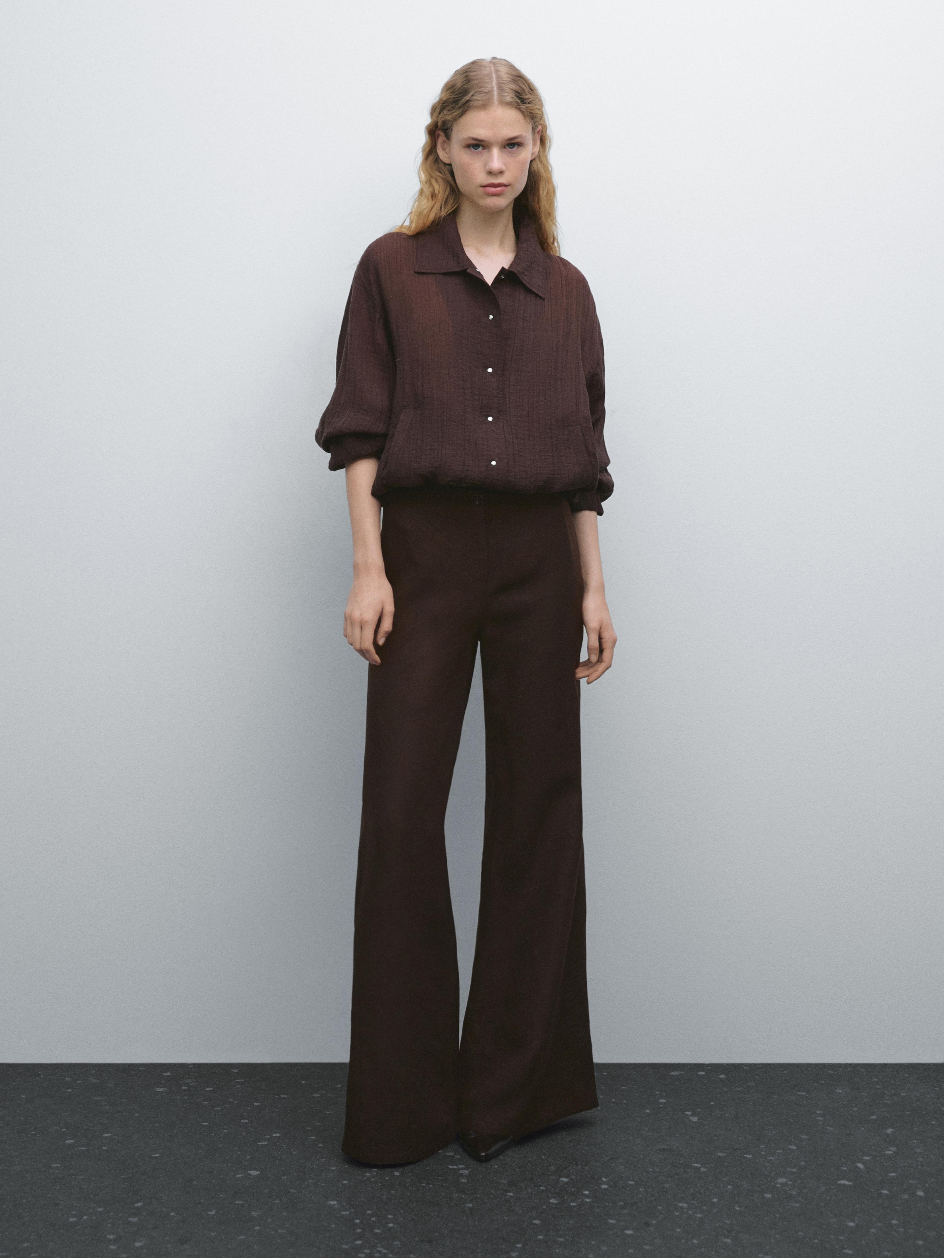 Flared trousers with seams