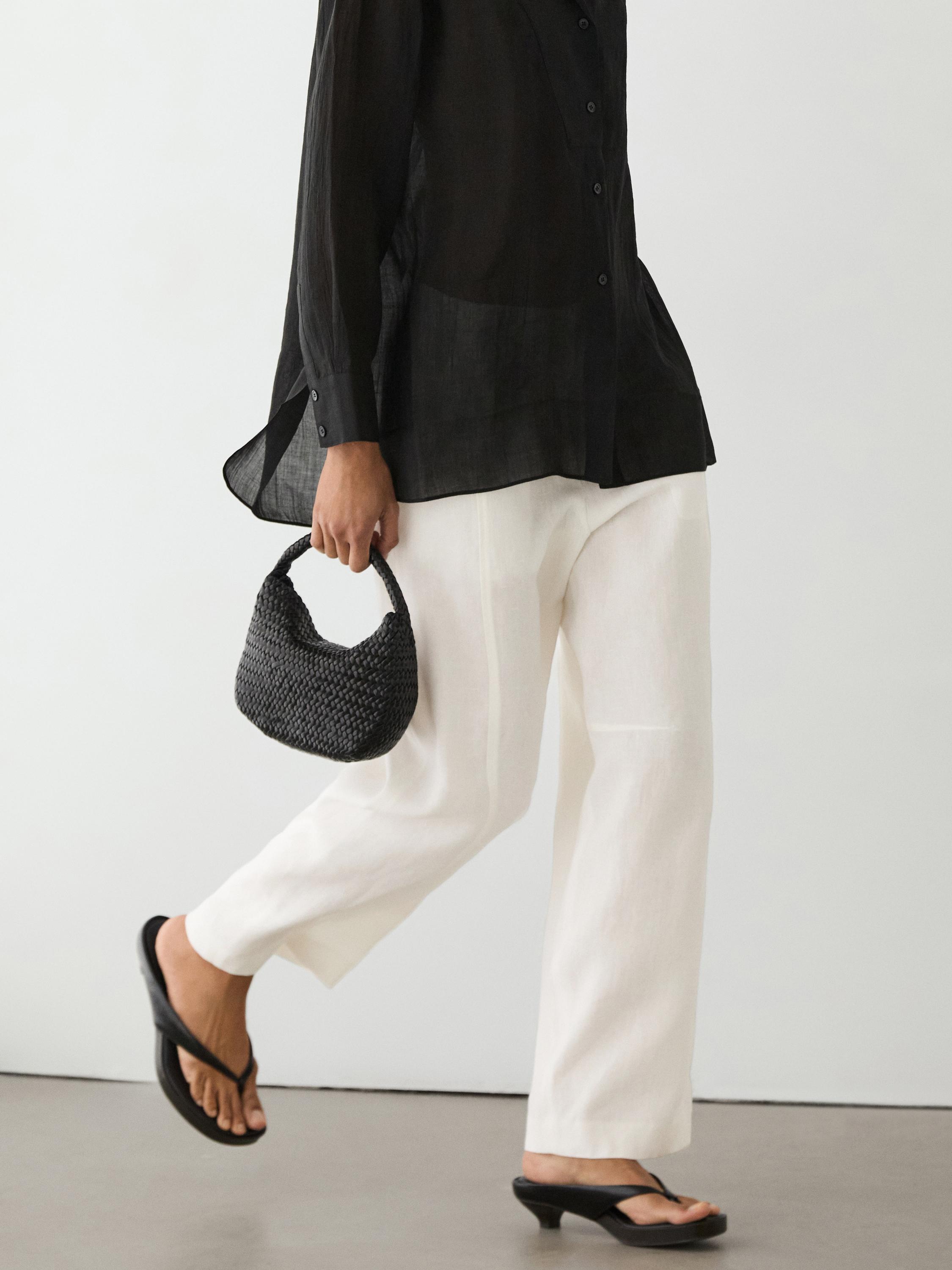 Flowing semi-sheer shirt with chest detail — BLACK