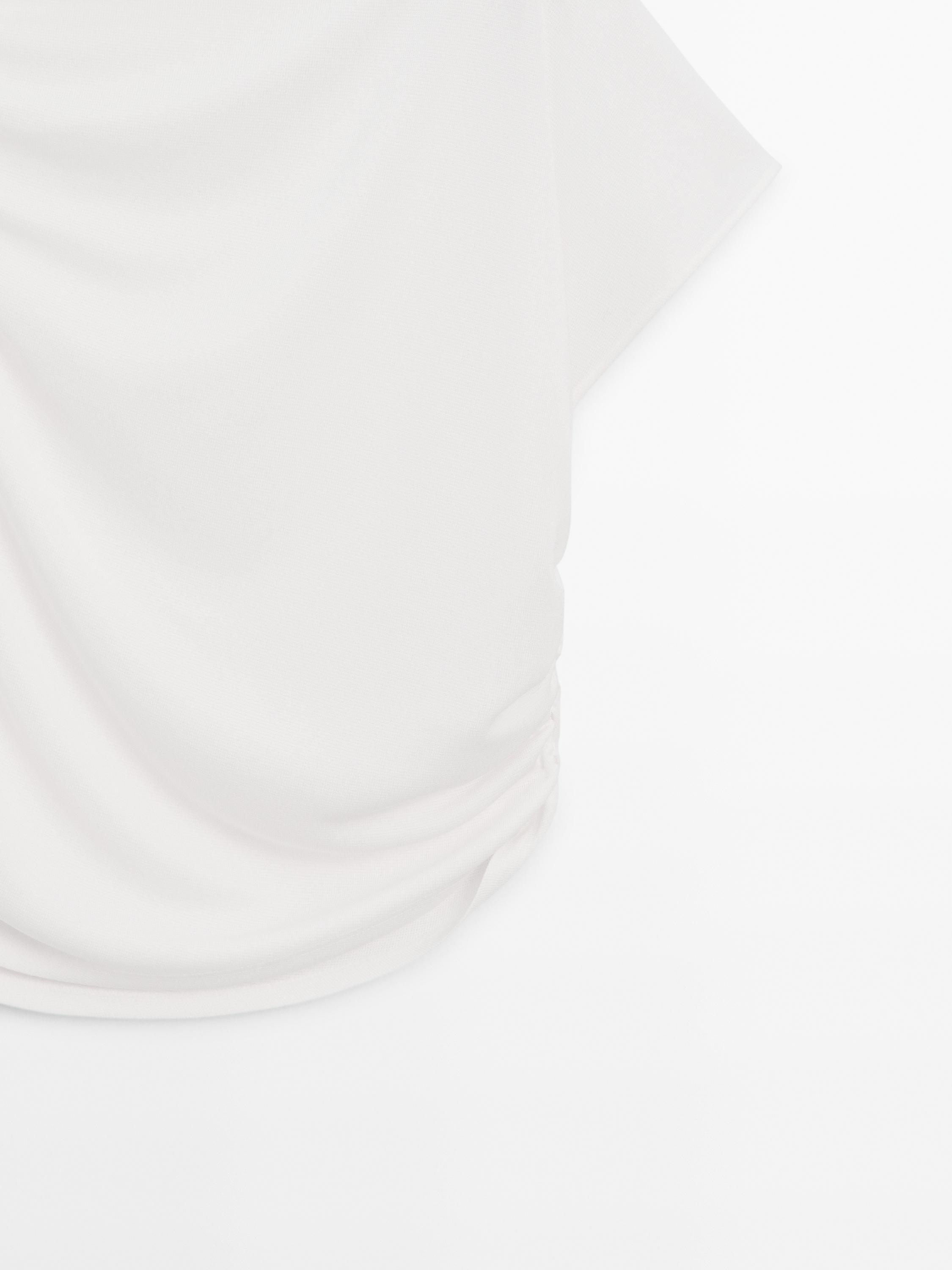 Draped top with asymmetric neckline