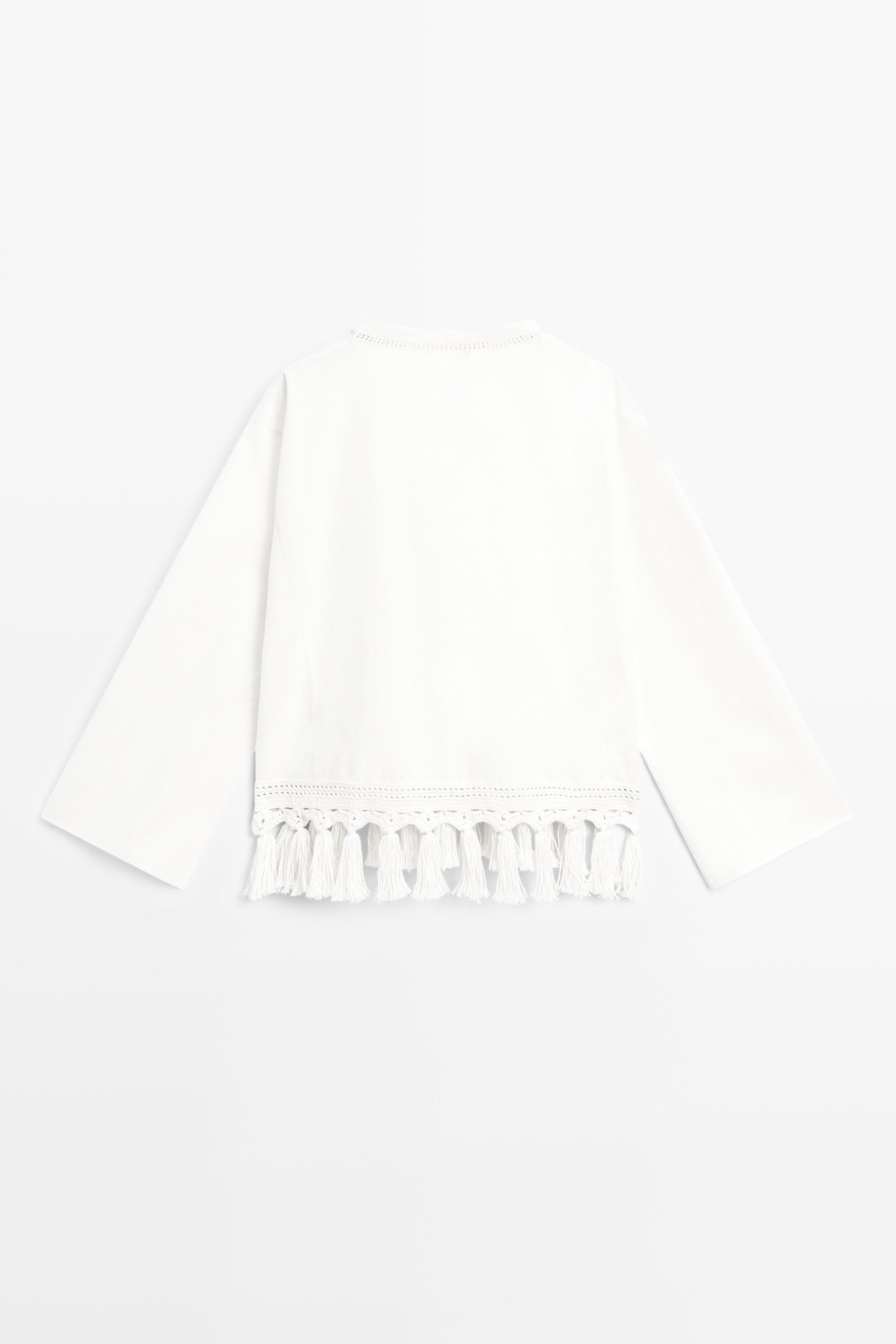 Embroidered blouse with fringed hem — WHITE
