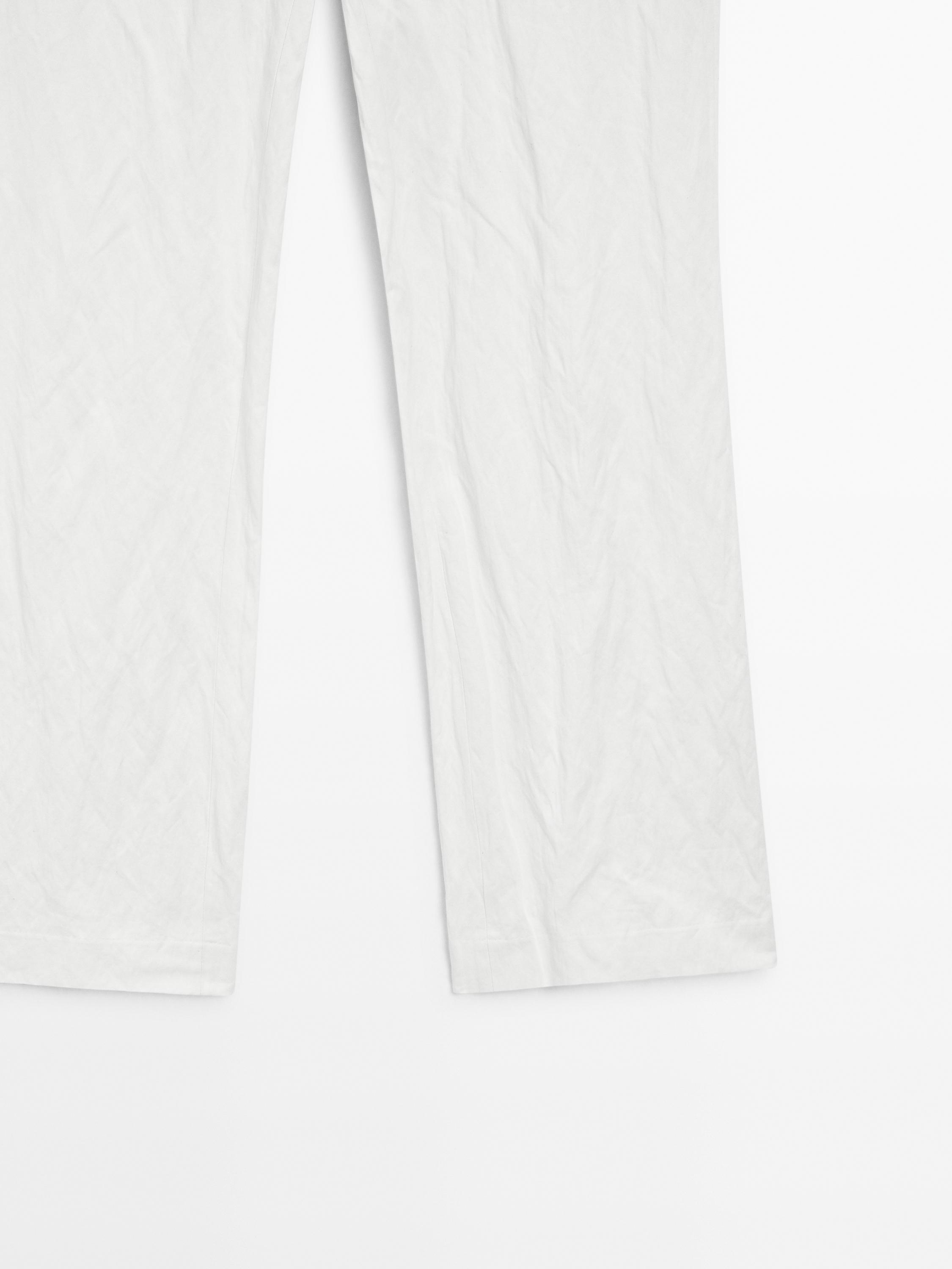 Slim fit low-rise trousers with buckles
