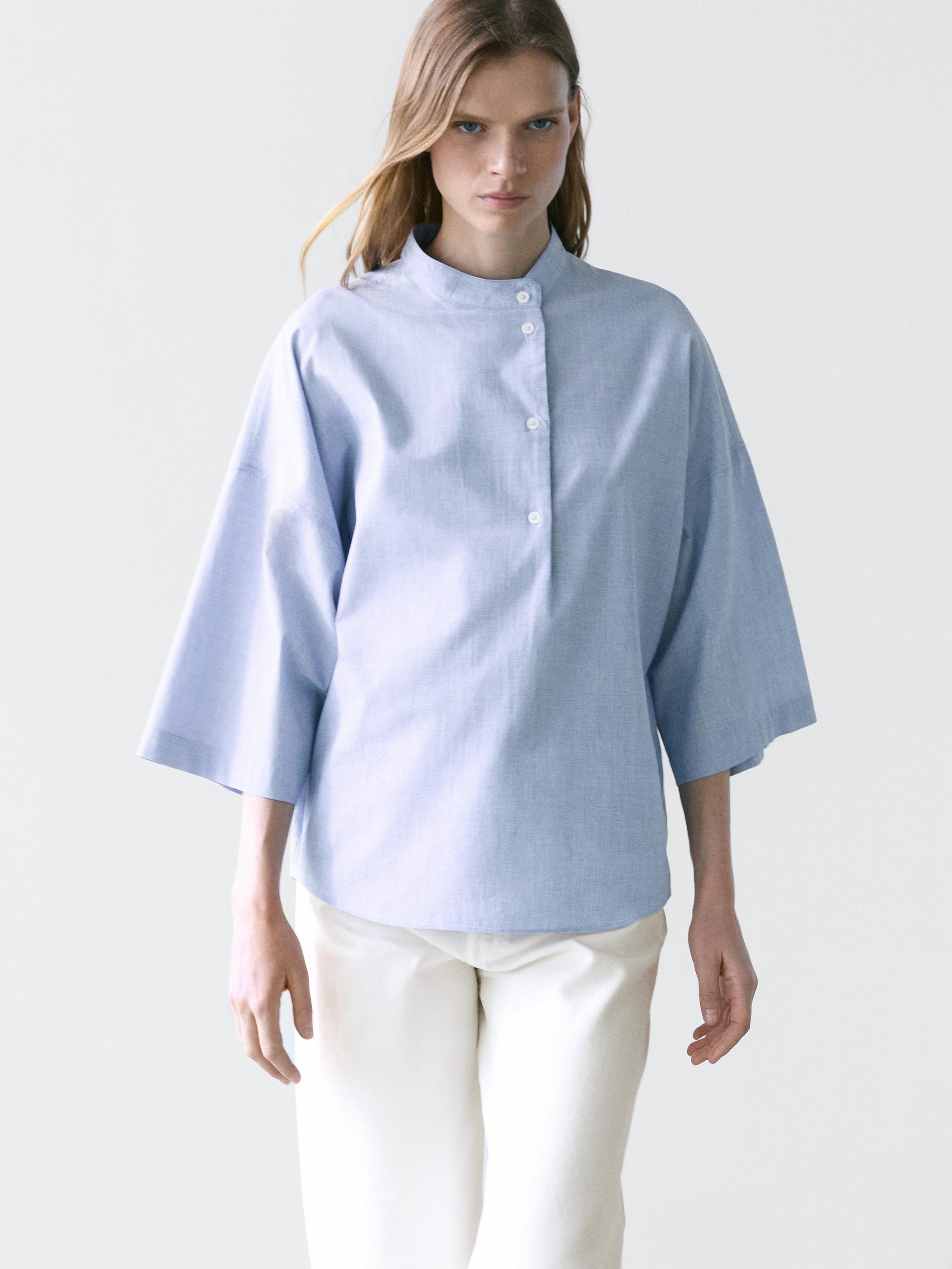 Flowing blouse with buttoned collar detail — Denim blue