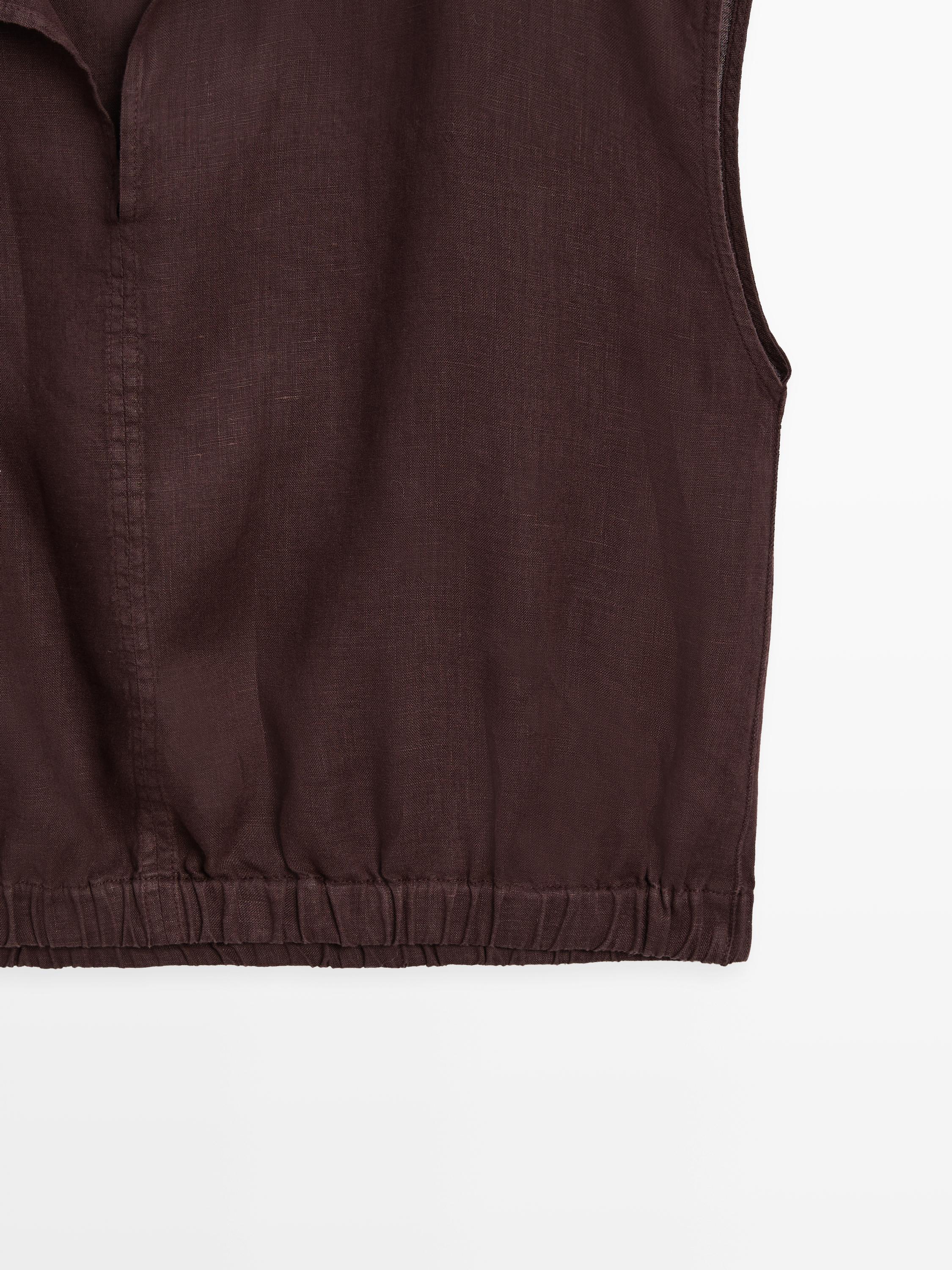 Linen blouse with elasticated hem