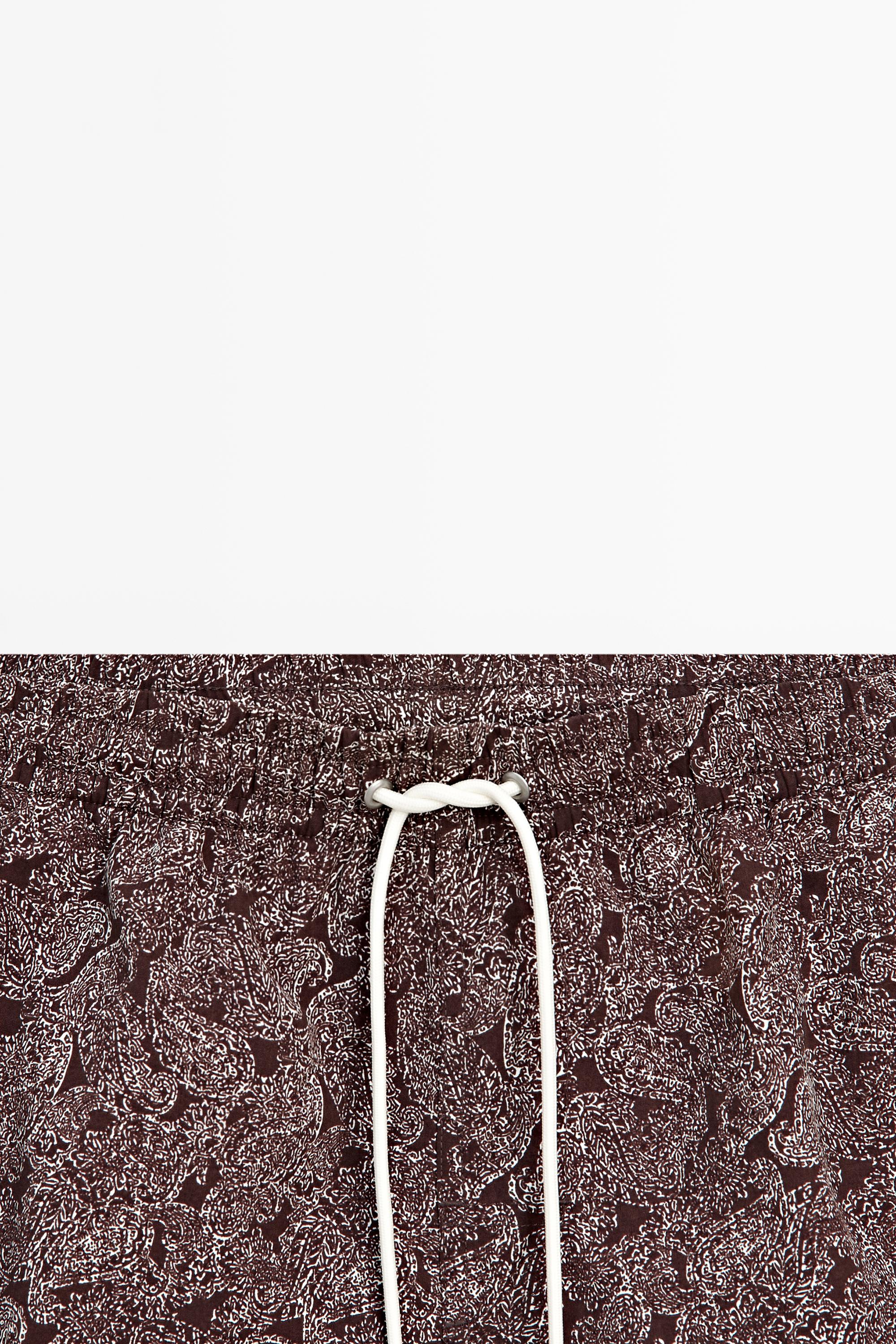 Paisley print swimming trunks — RUSSET