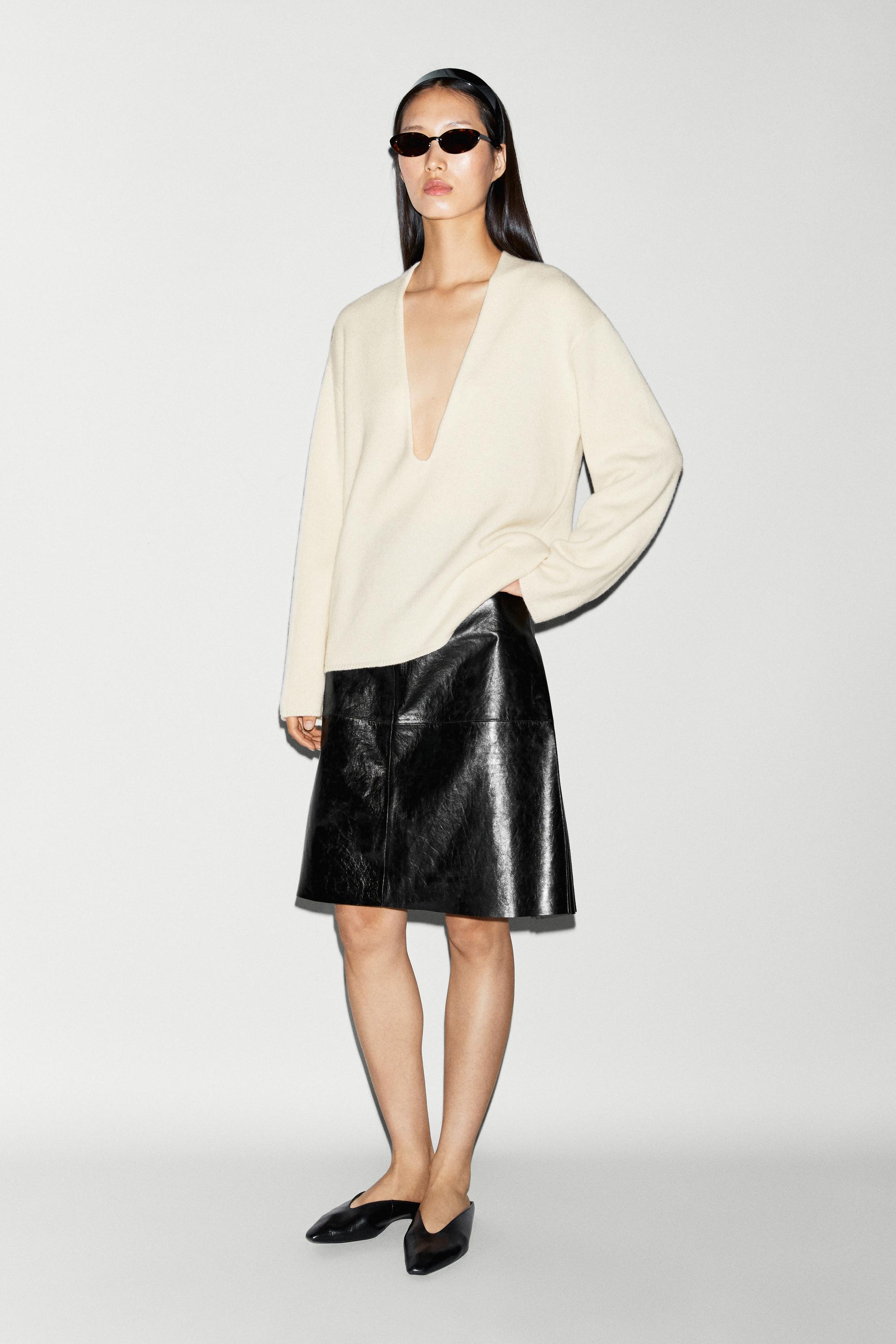 Long-line knit sweater with neckline detail — OCHRE MARL