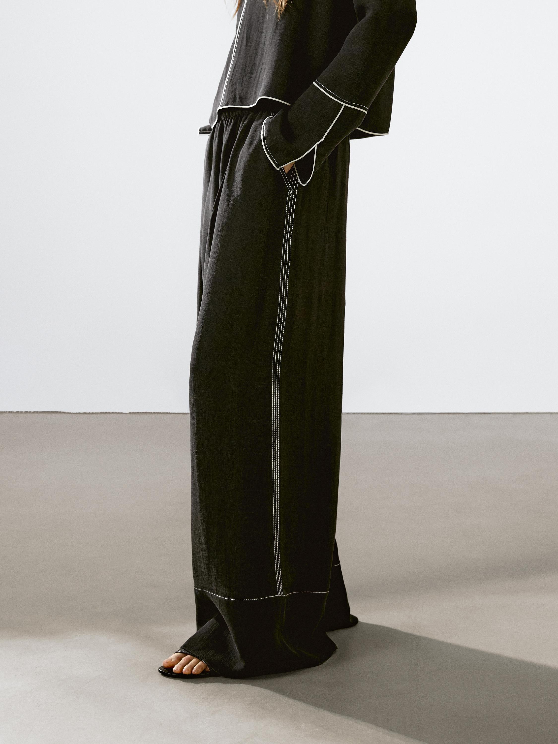 Flowing trousers with contrast topstitching