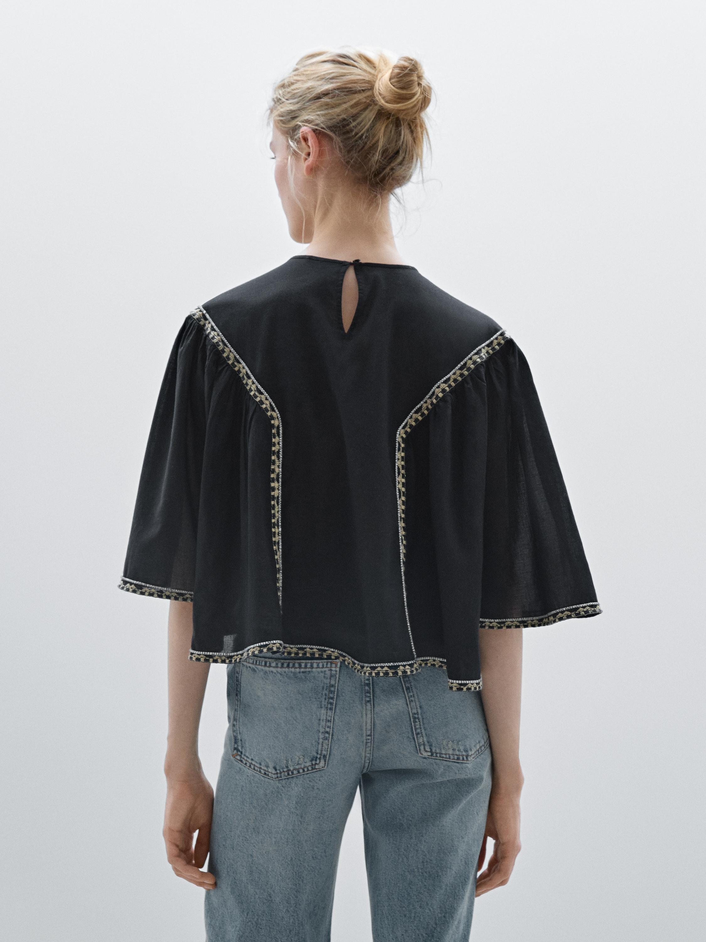 Flowing blouse with embroidered details