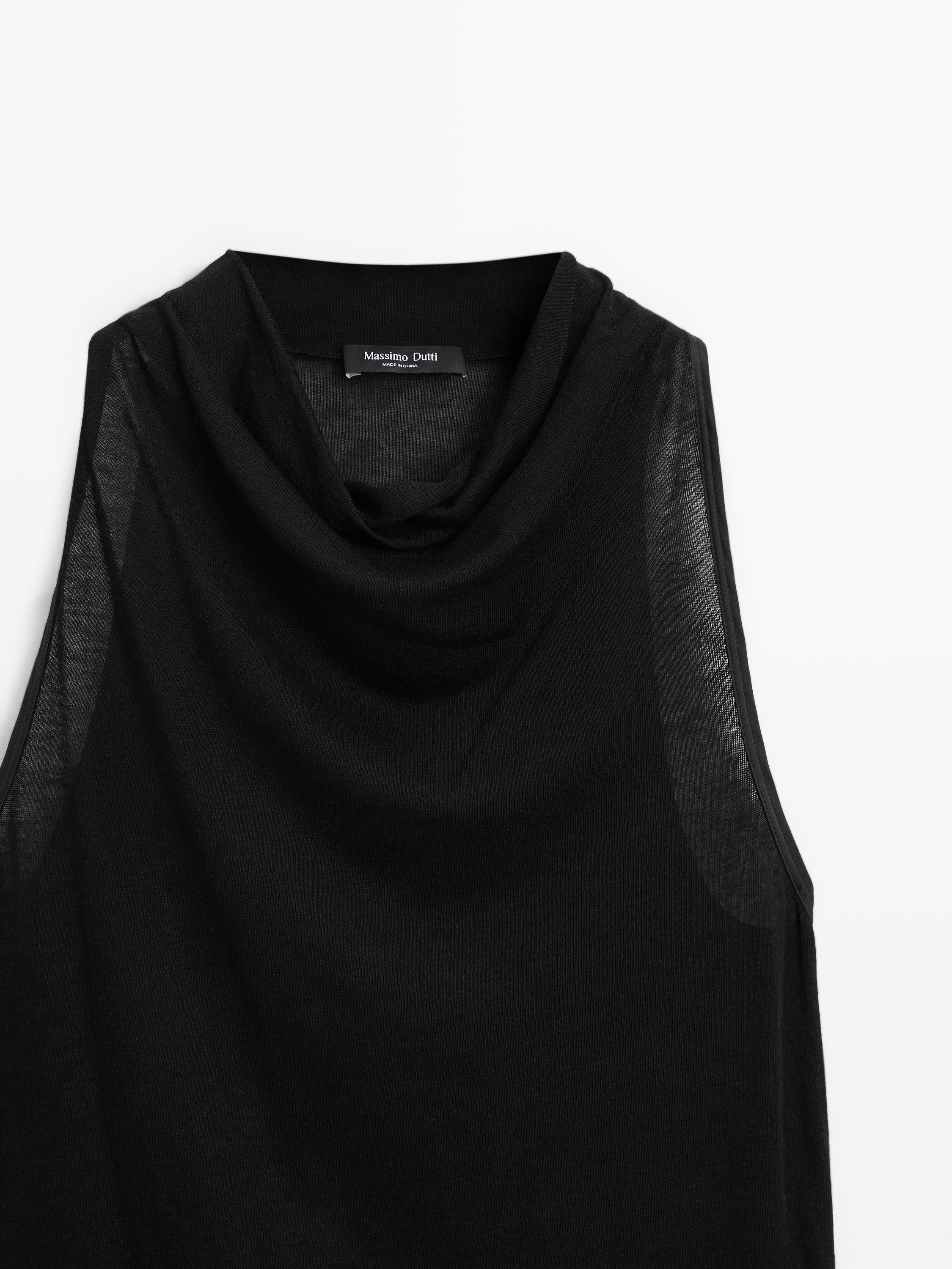 Sleeveless top with draped neckline