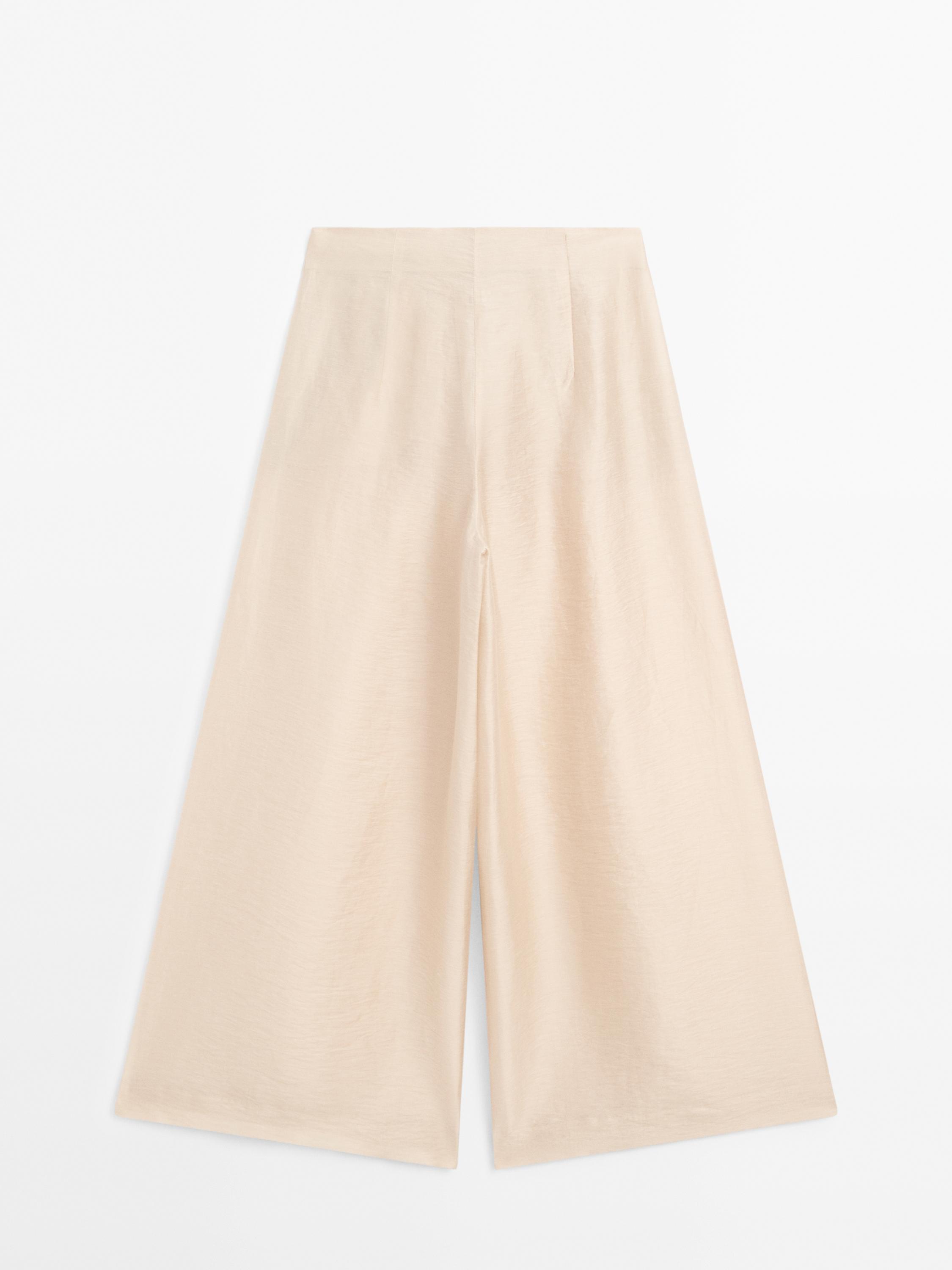 Splývavé nohavice z ľanovej zmesi so záševkami