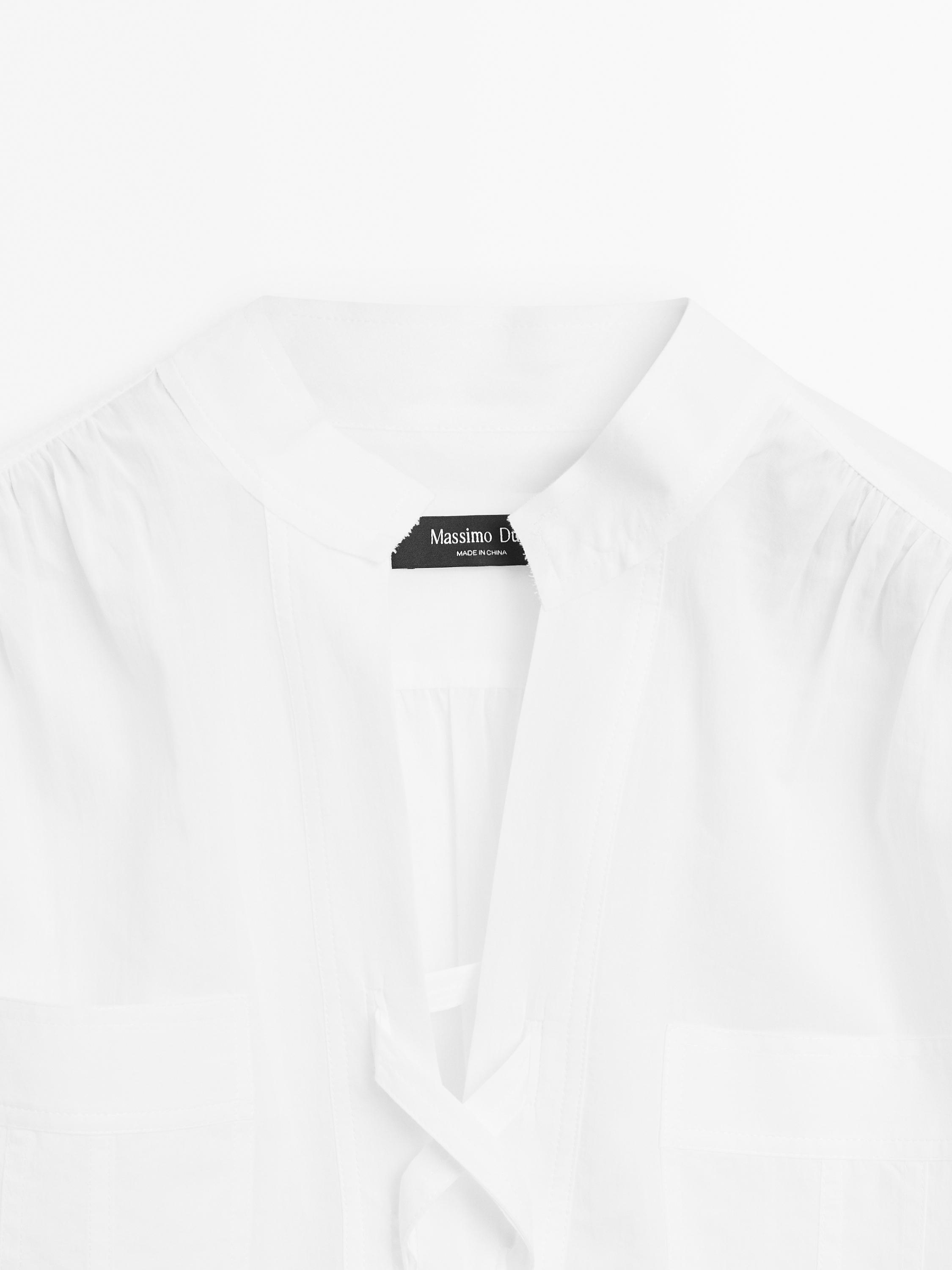 Stand collar blouse with tie detail