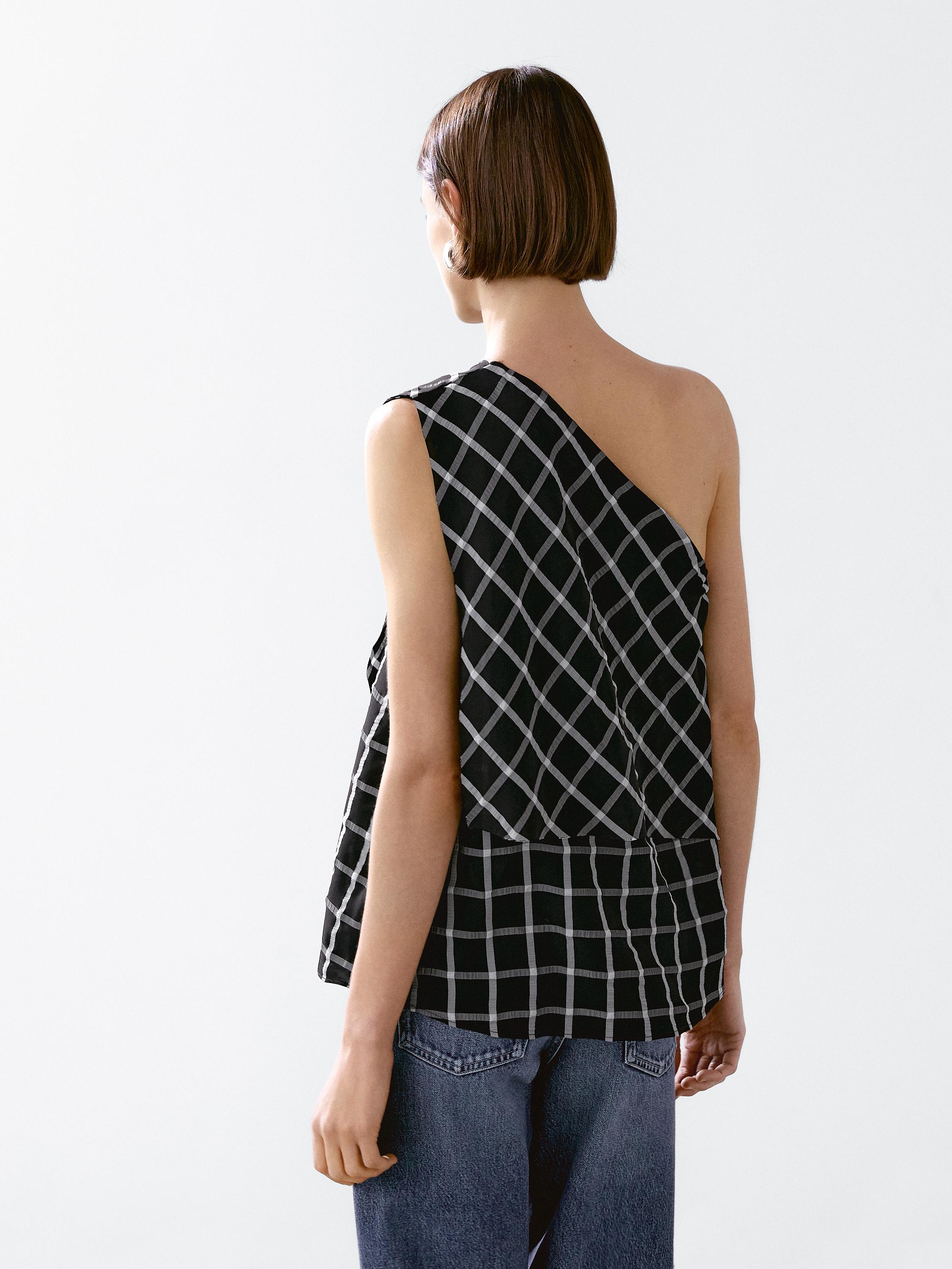 Checked top with asymmetric neckline