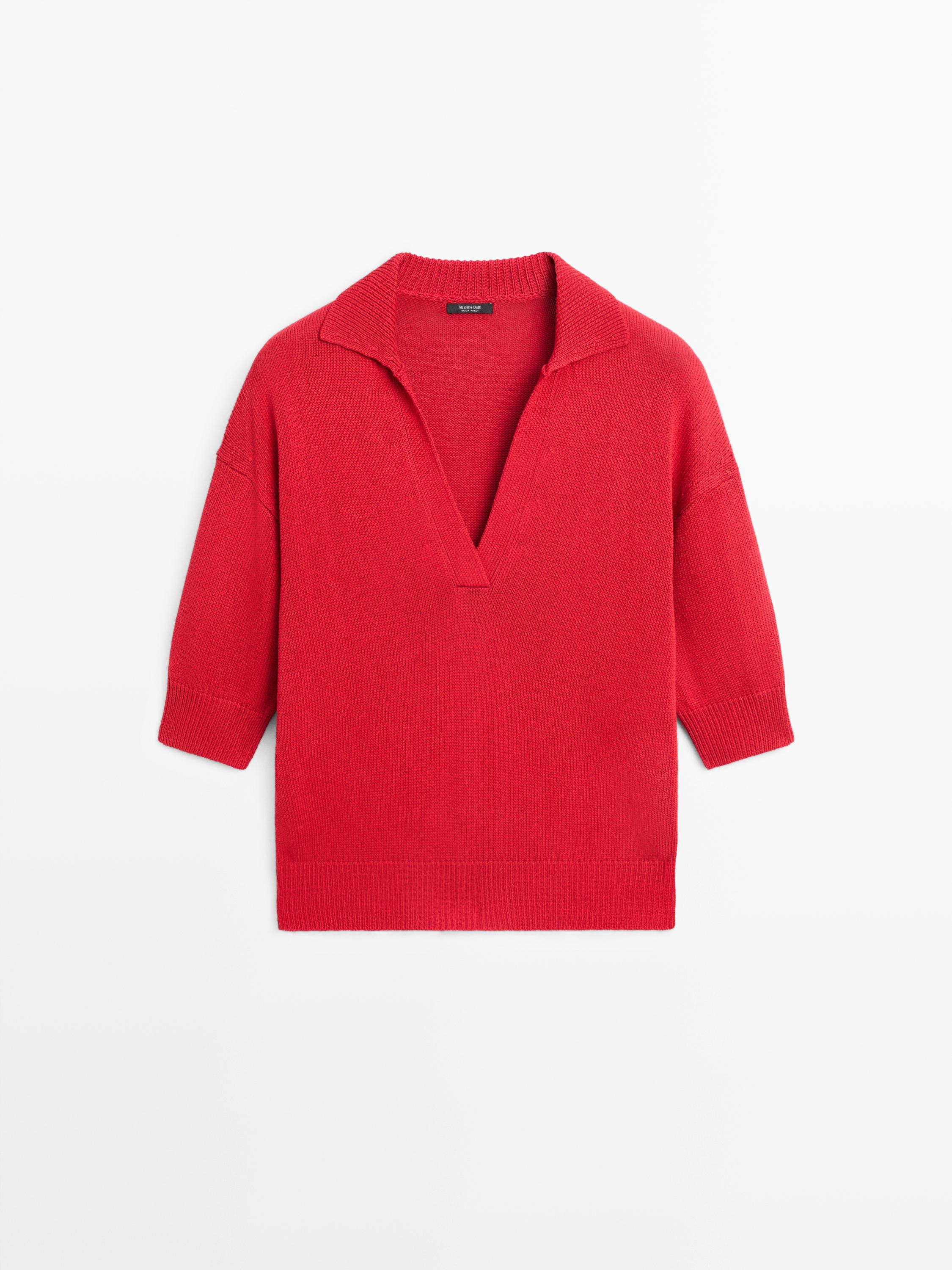 Front view of a red polo neck sweater with three-quarter sleeves and ribbed hem.