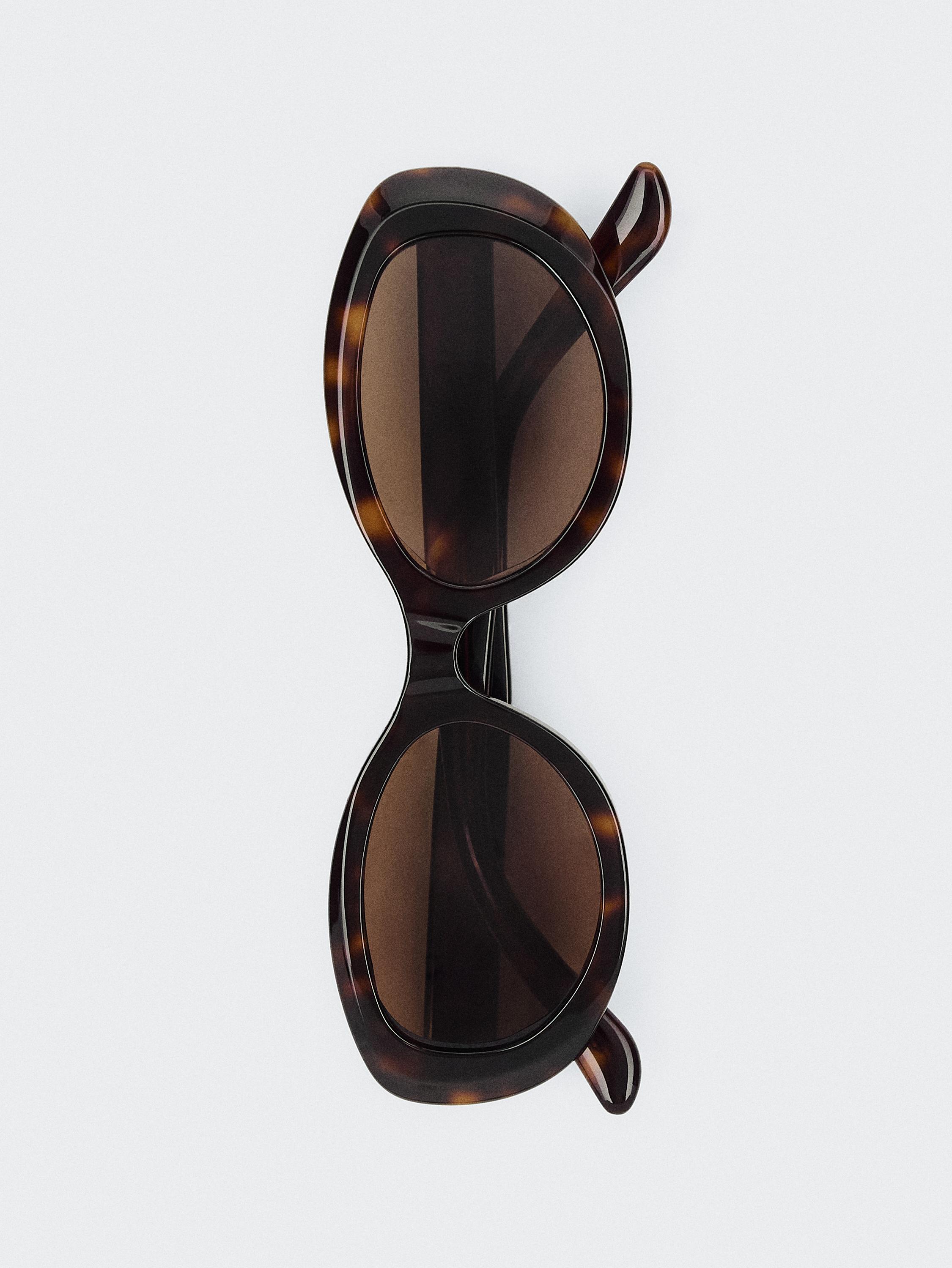 Oval tortoiseshell-effect sunglasses