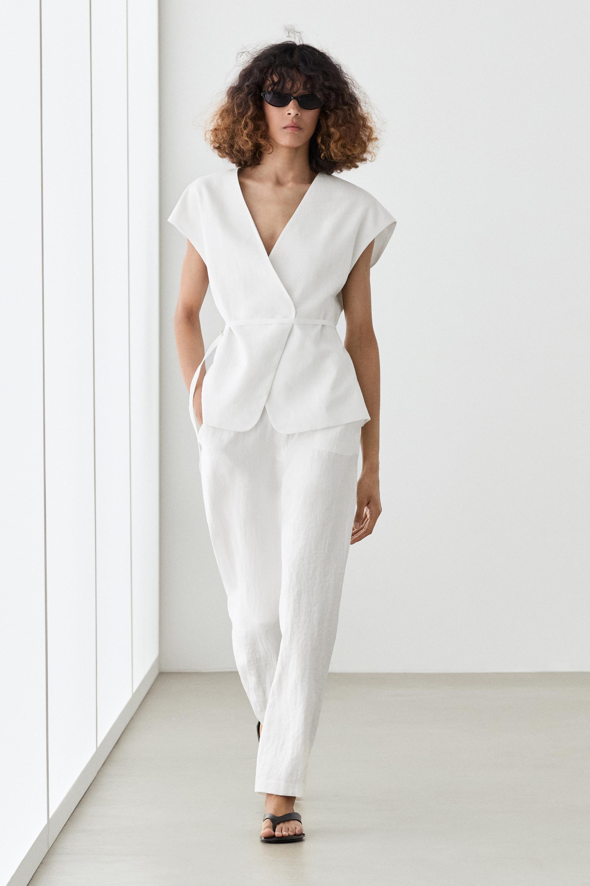 Flowing trousers with buckles — WHITE
