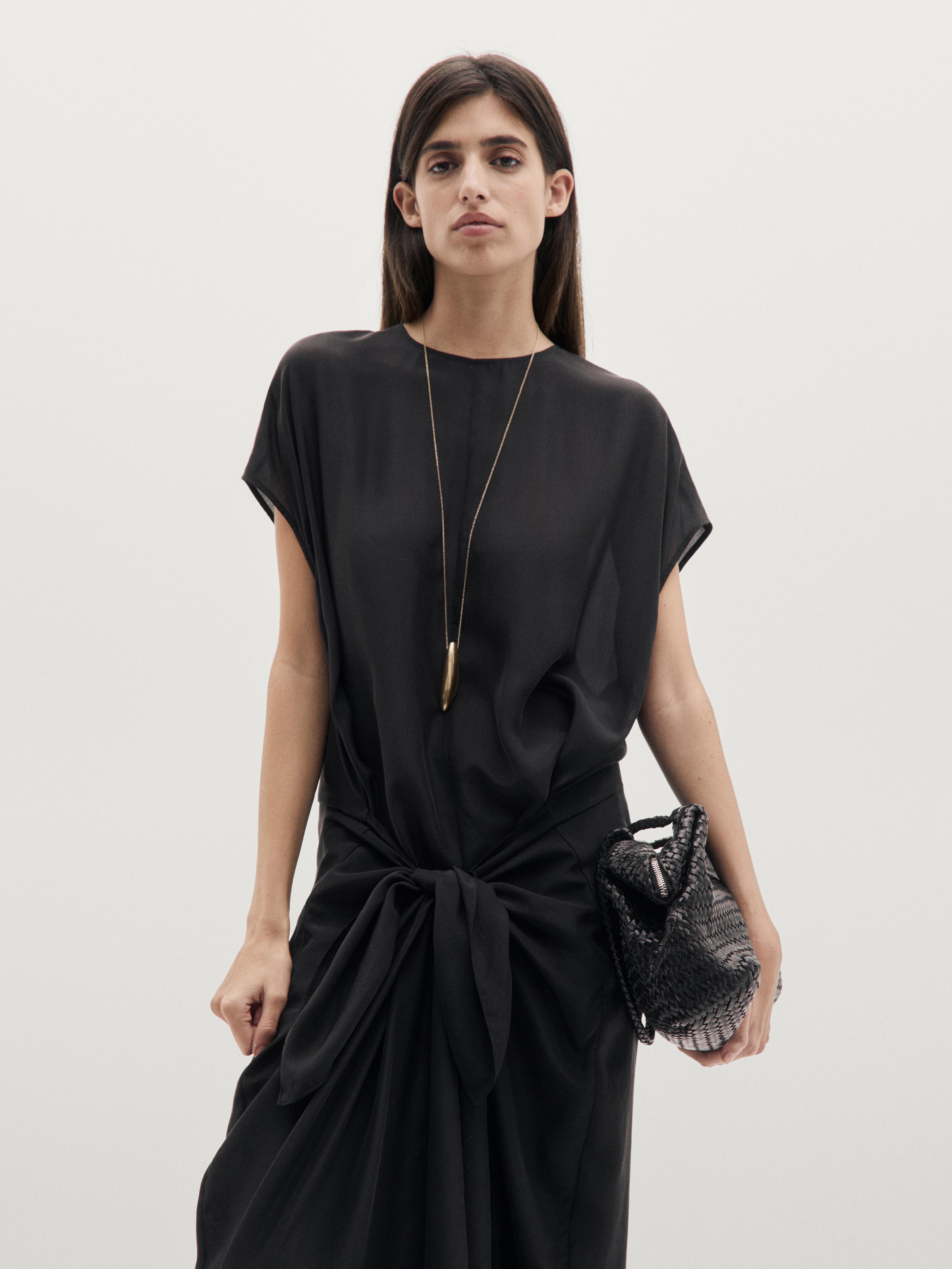 Flowing jumpsuit with knot detail