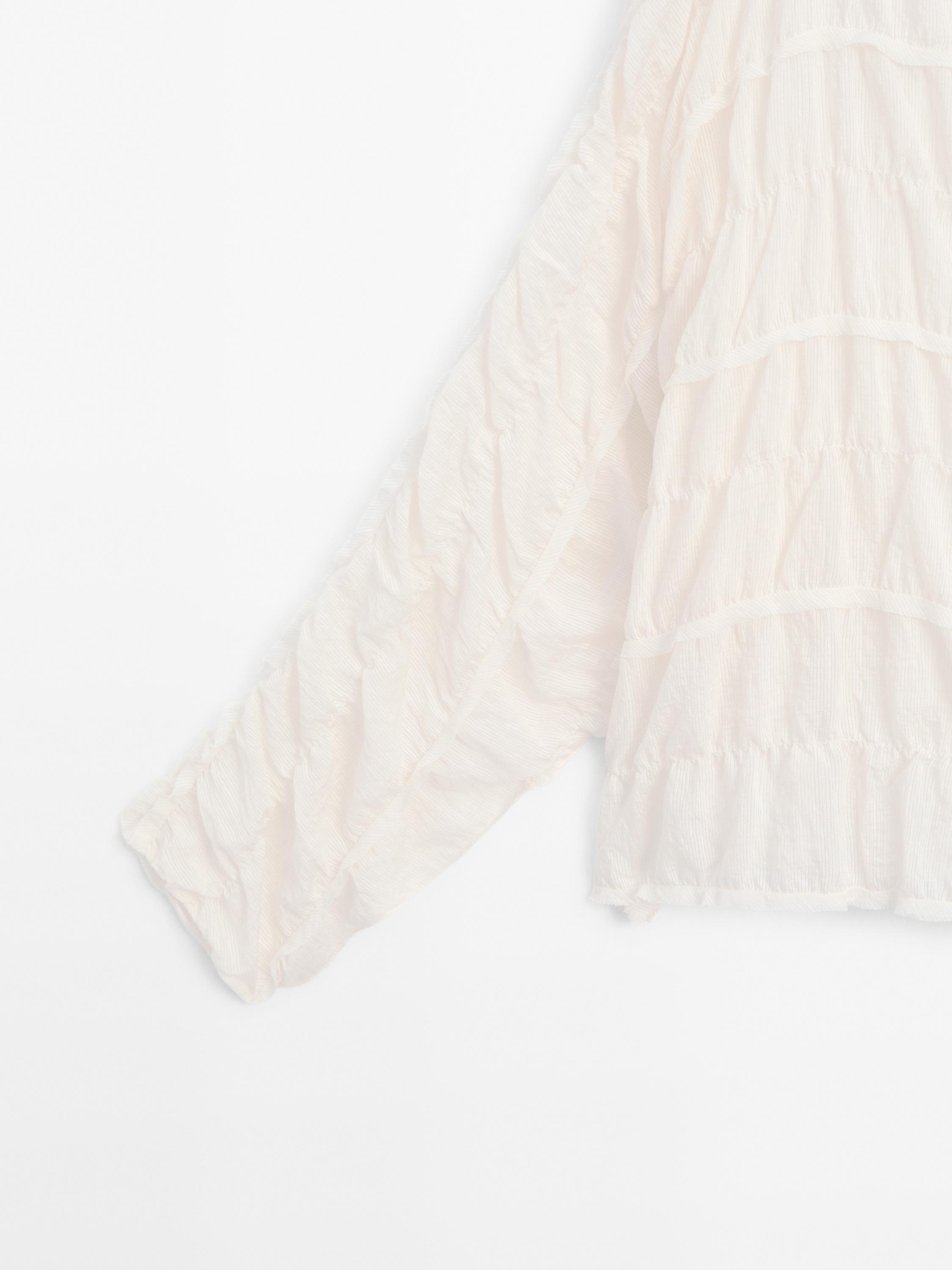 Flowing blouse with gathered detail