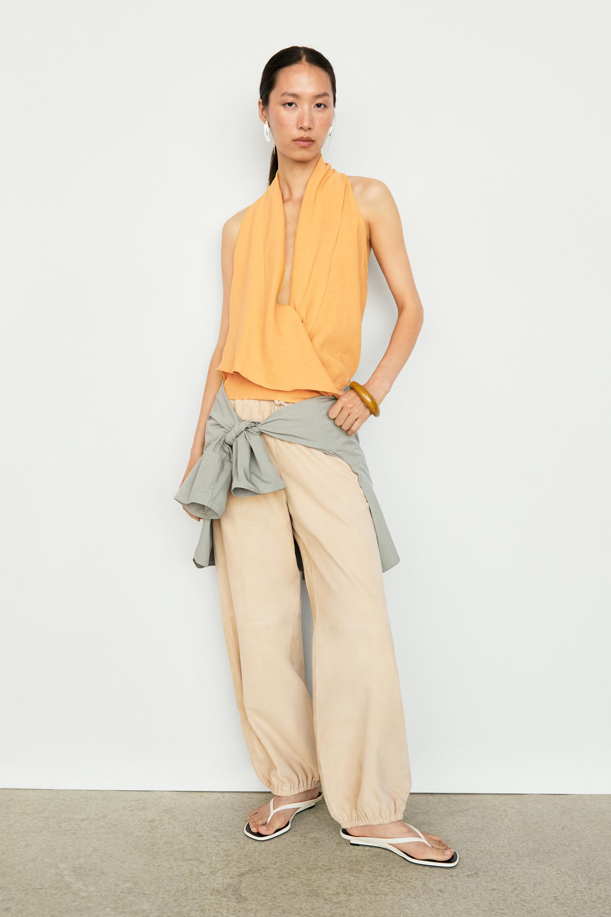 Flowing halter top with ruffle detail — YELLOW