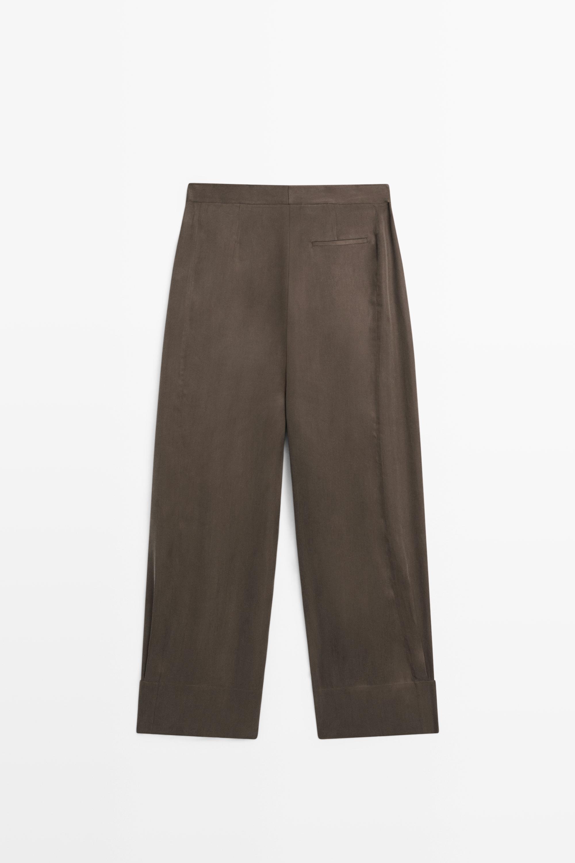 Total look flowing trousers with buttoned hems — PLUM