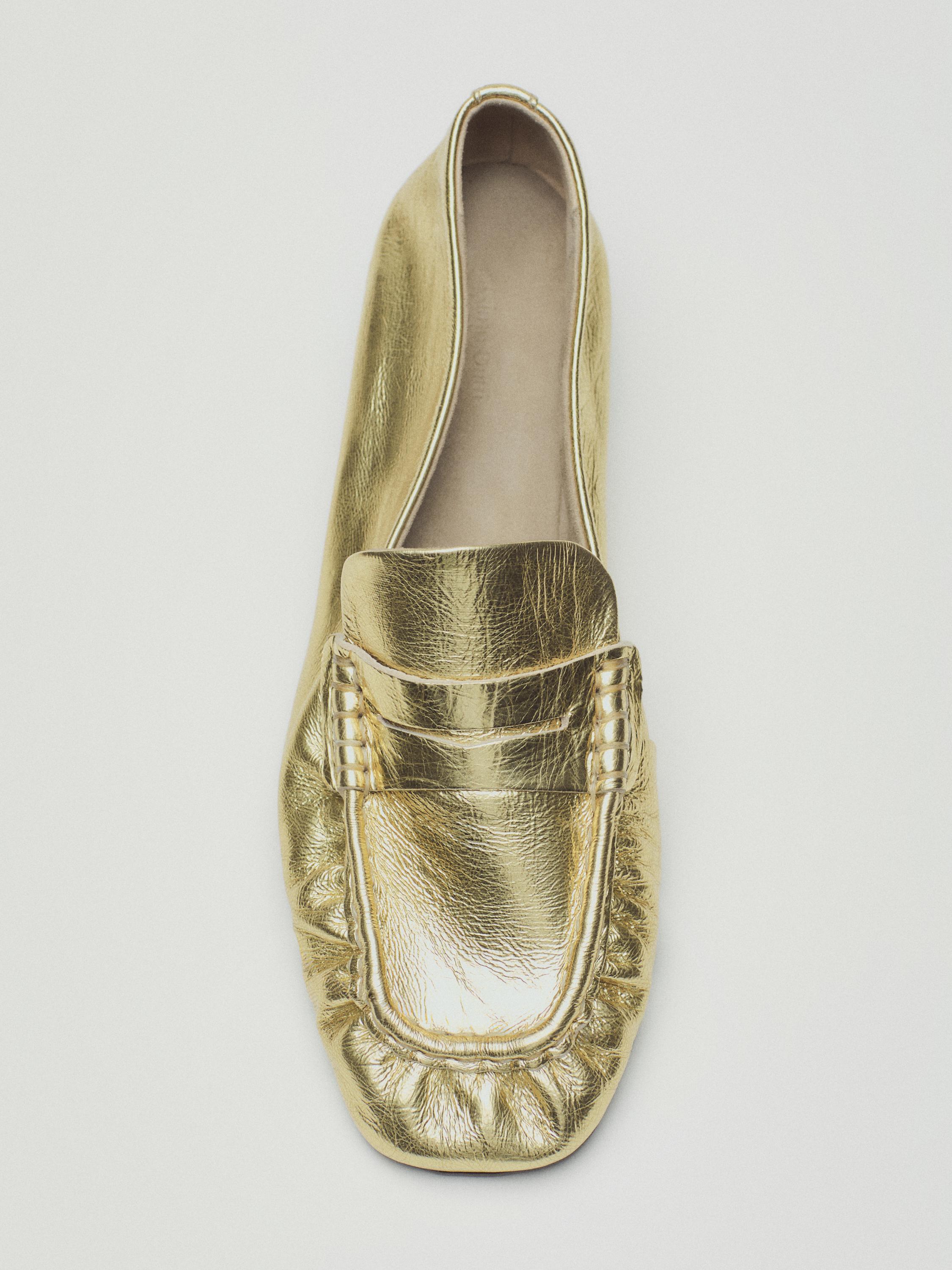 Gold penny loafers