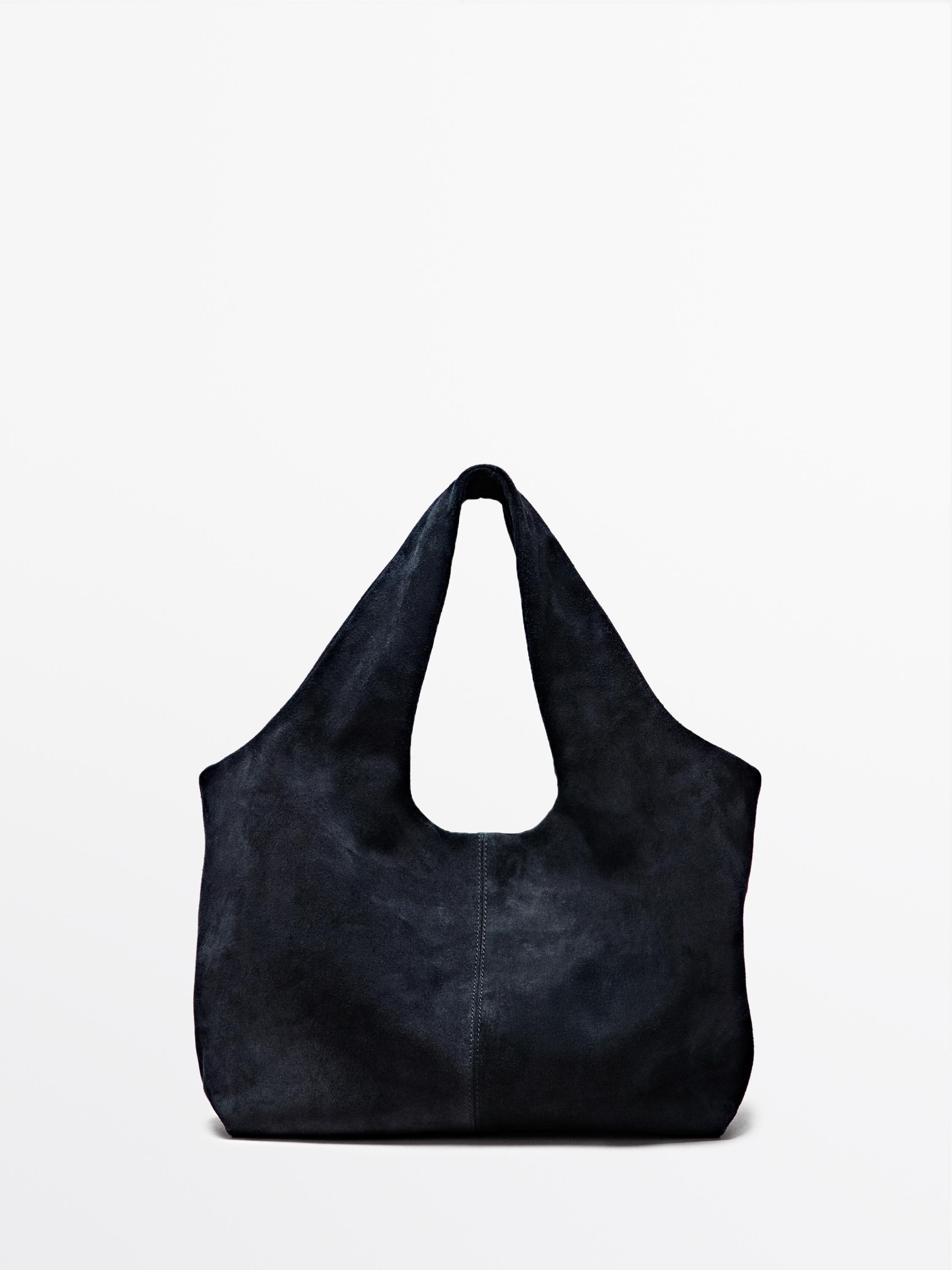 Vorderansicht einer marineblauen Shopper-Tasche mit großzügigem Design und doppelten Henkeln.