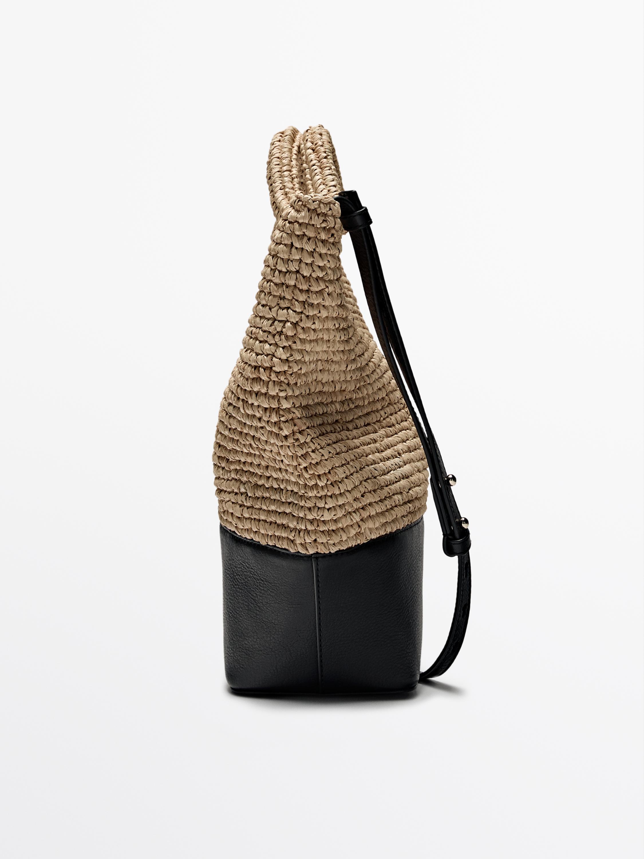 Natural raffia bag with leather base
