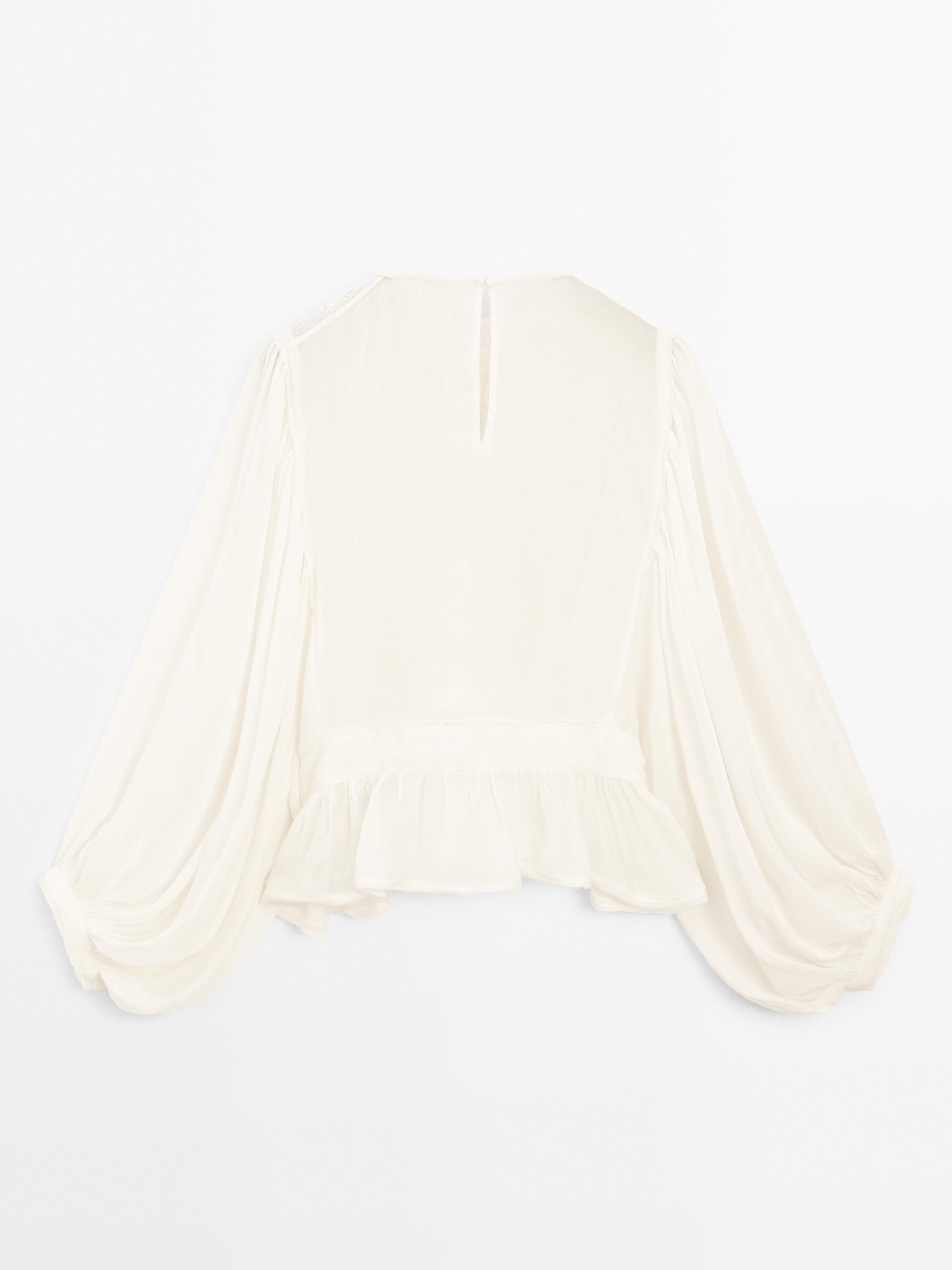 Flowing embroidered peplum blouse