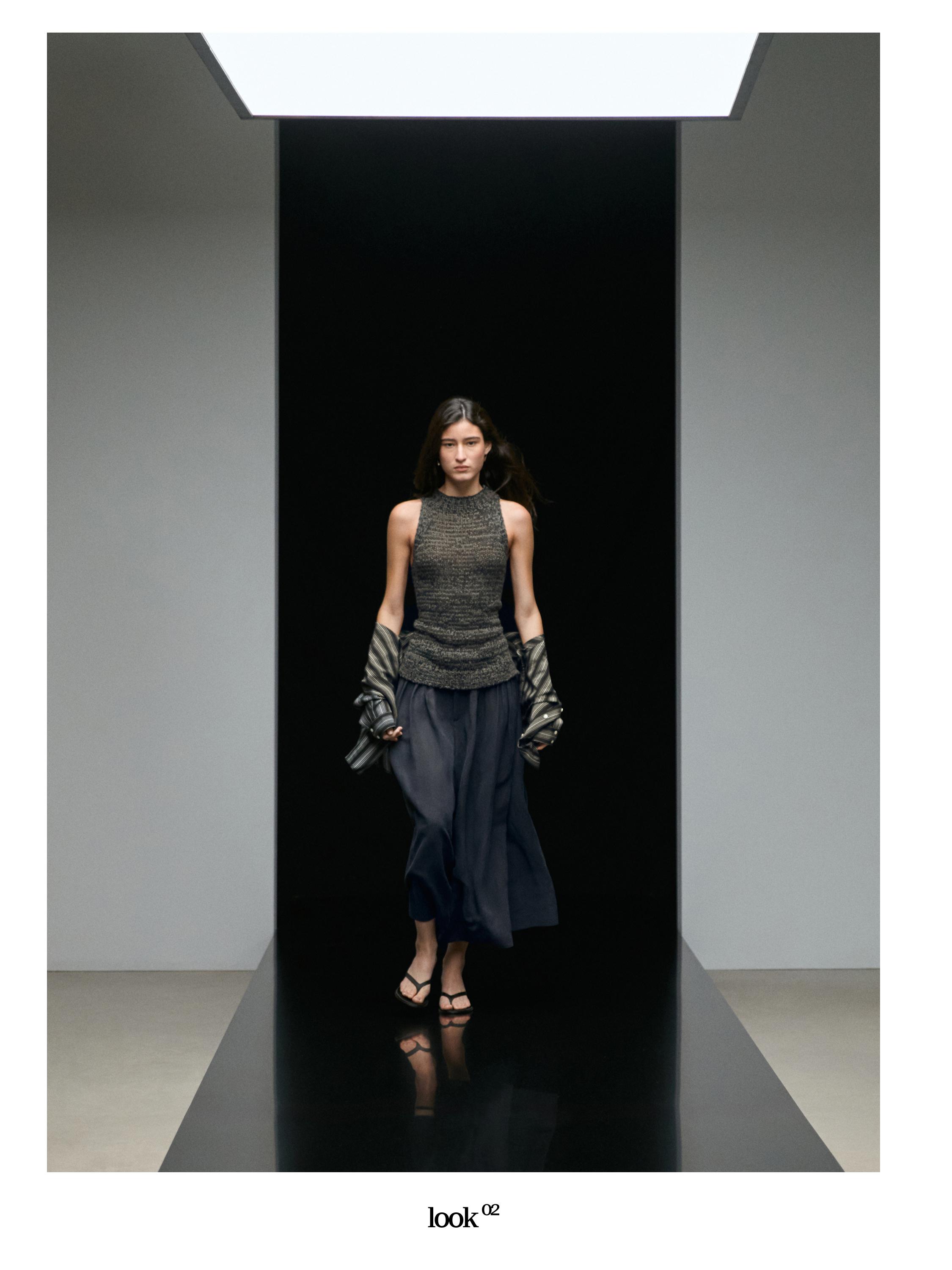 Dark gray sleeveless top and navy blue long skirt set.