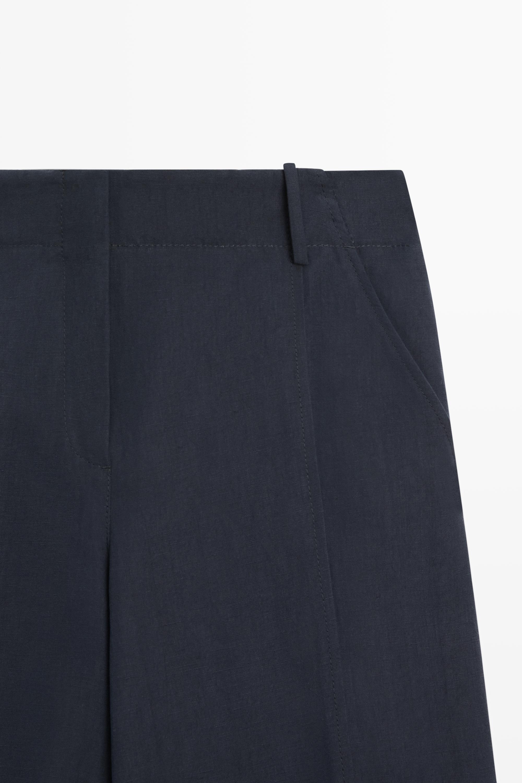 Flowing linen blend pants with buttoned tab detail — NAVY BLUE