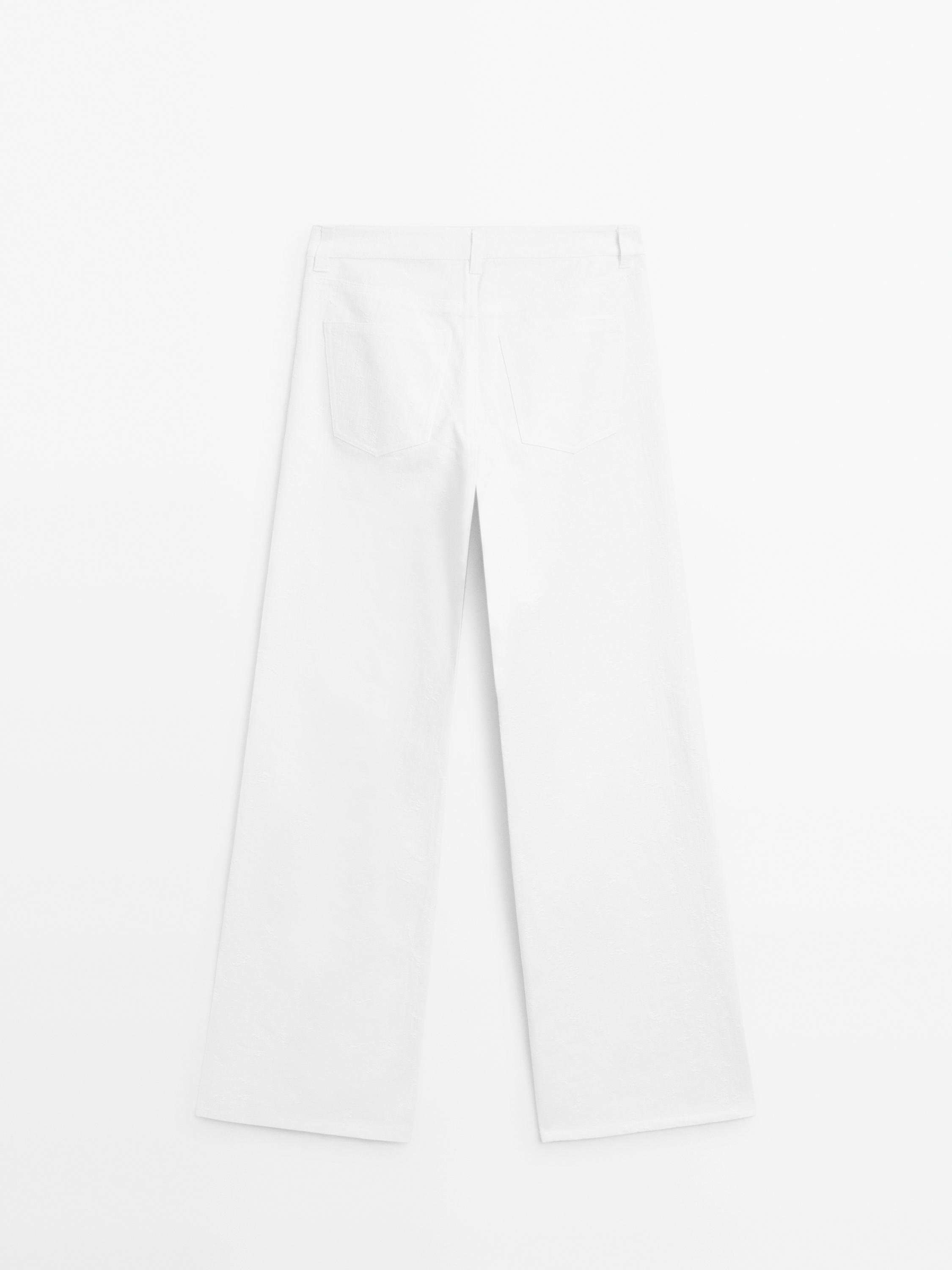 Teksturisane pantalone u stilu farmerki širokih nogavica