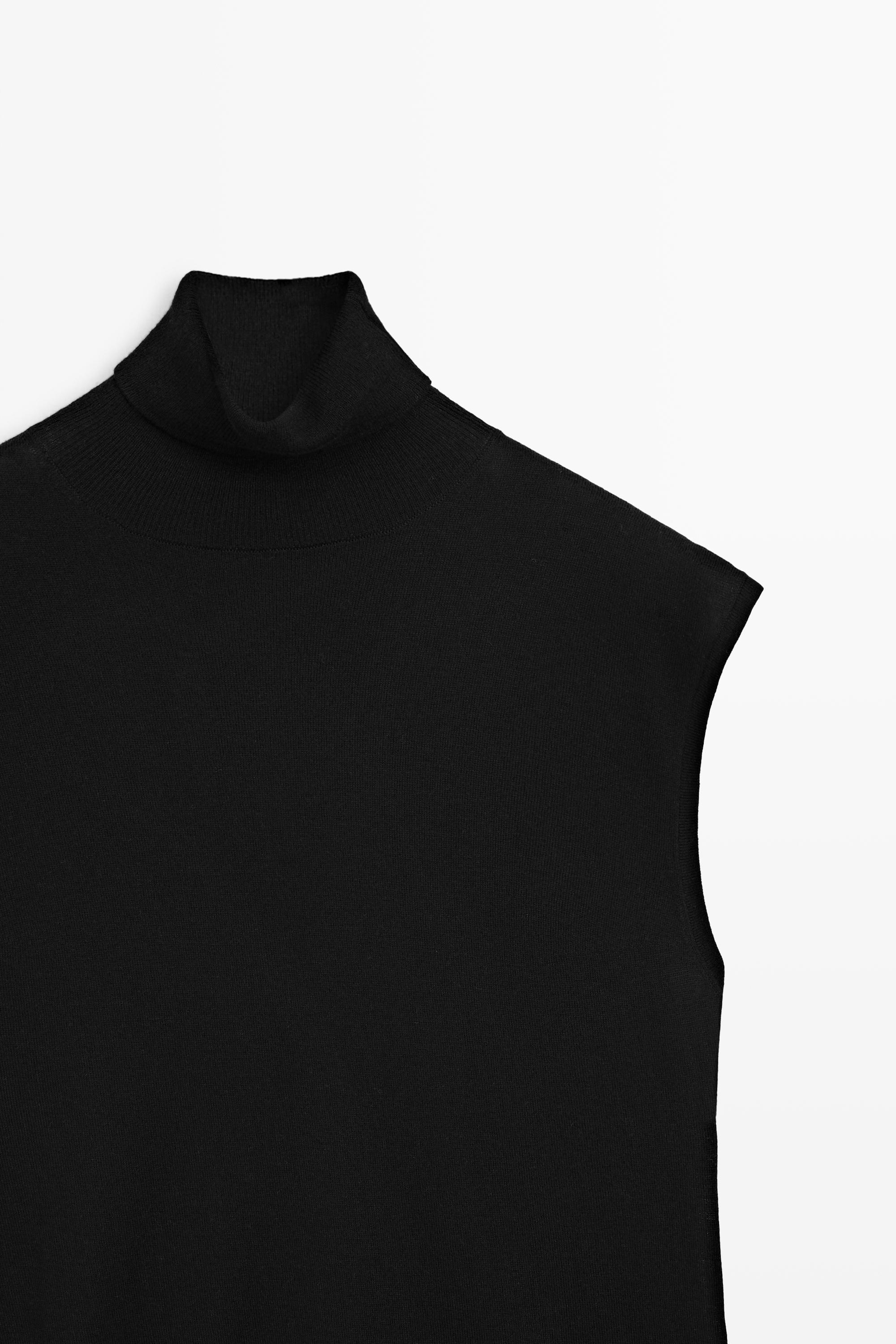 Asymmetric hem turtleneck top — BLACK