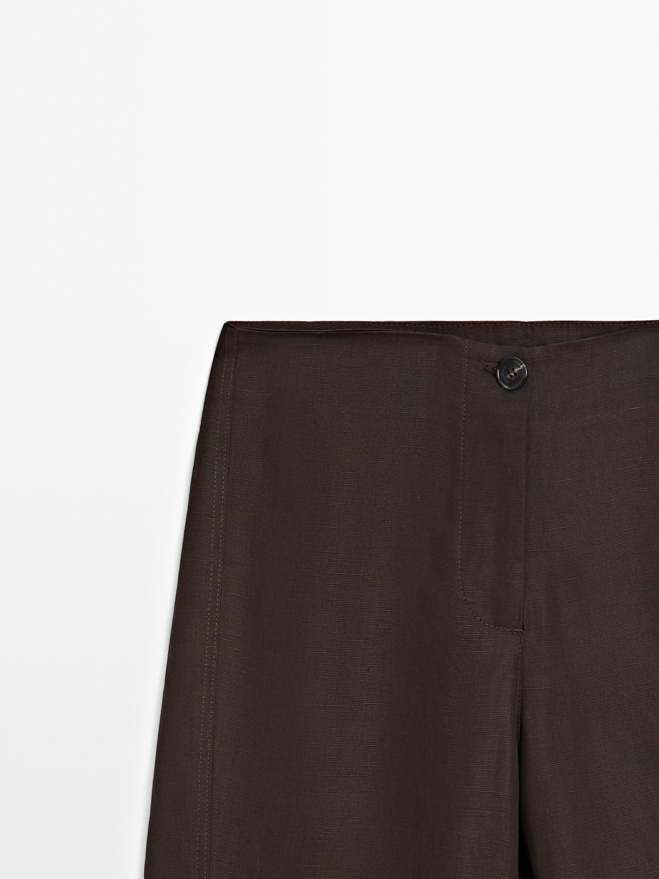 Flared trousers with seams