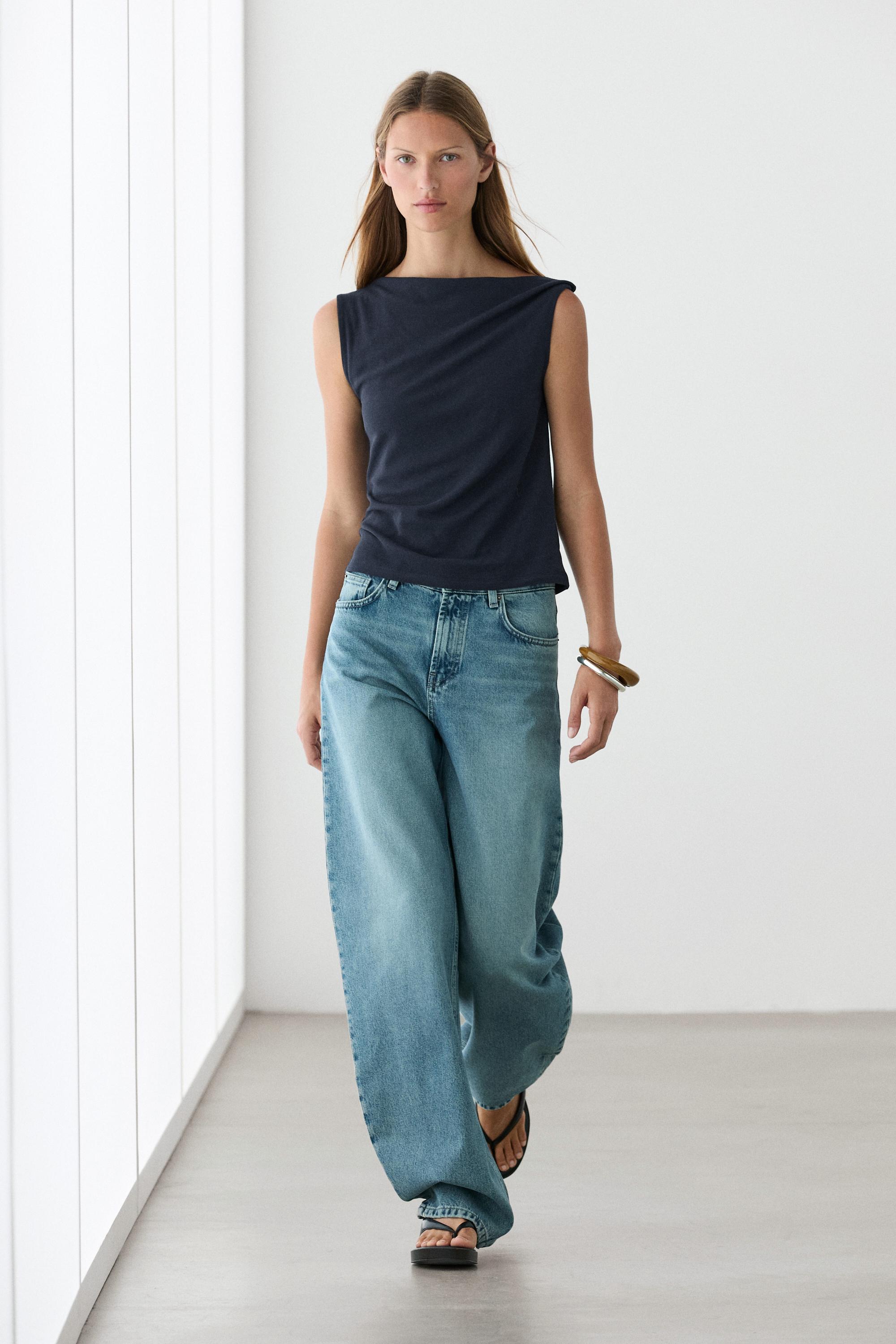 Asymmetric drop sleeve top