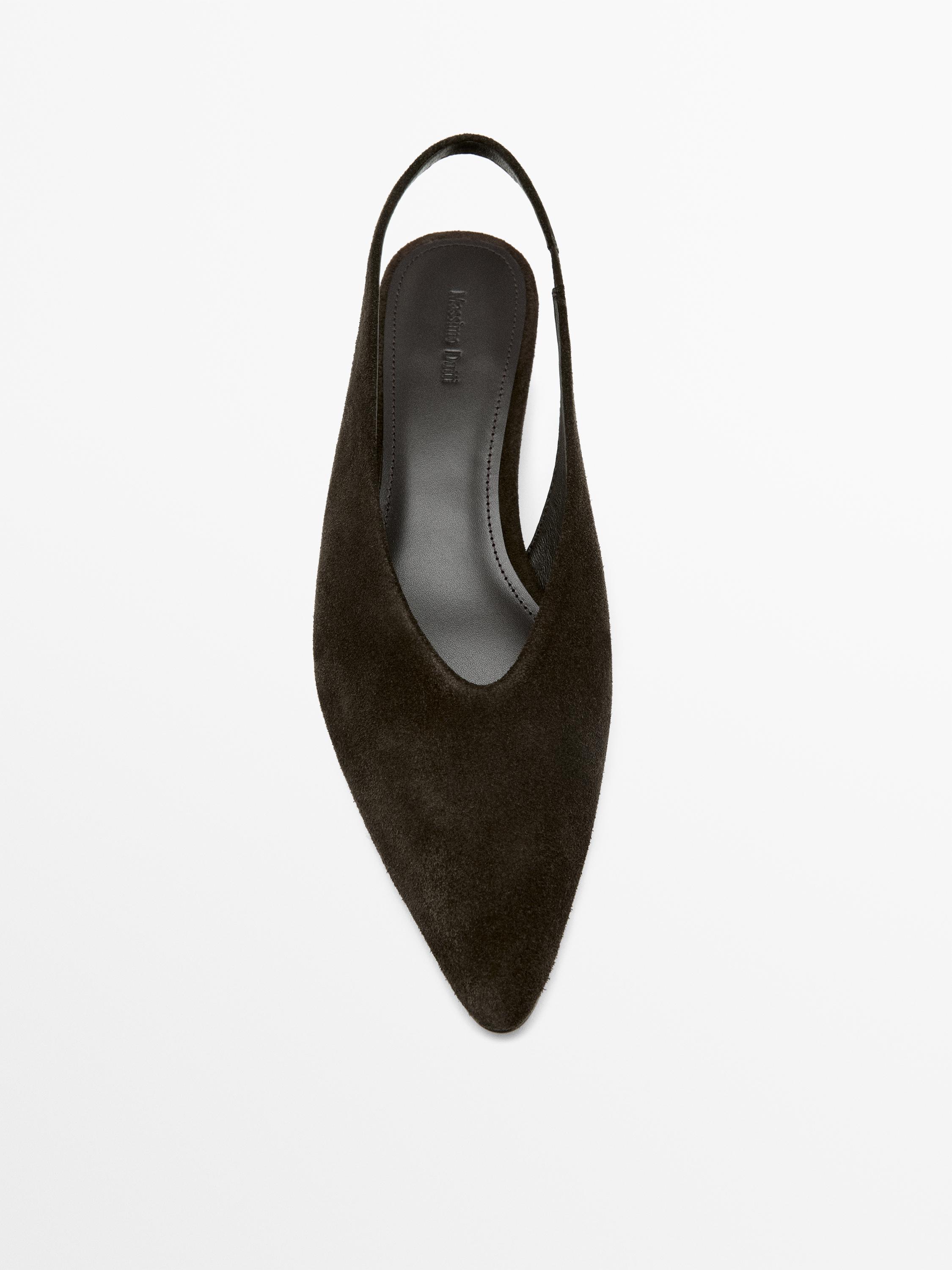 Top view of a brown backless shoe with a pointed toe and open heel.