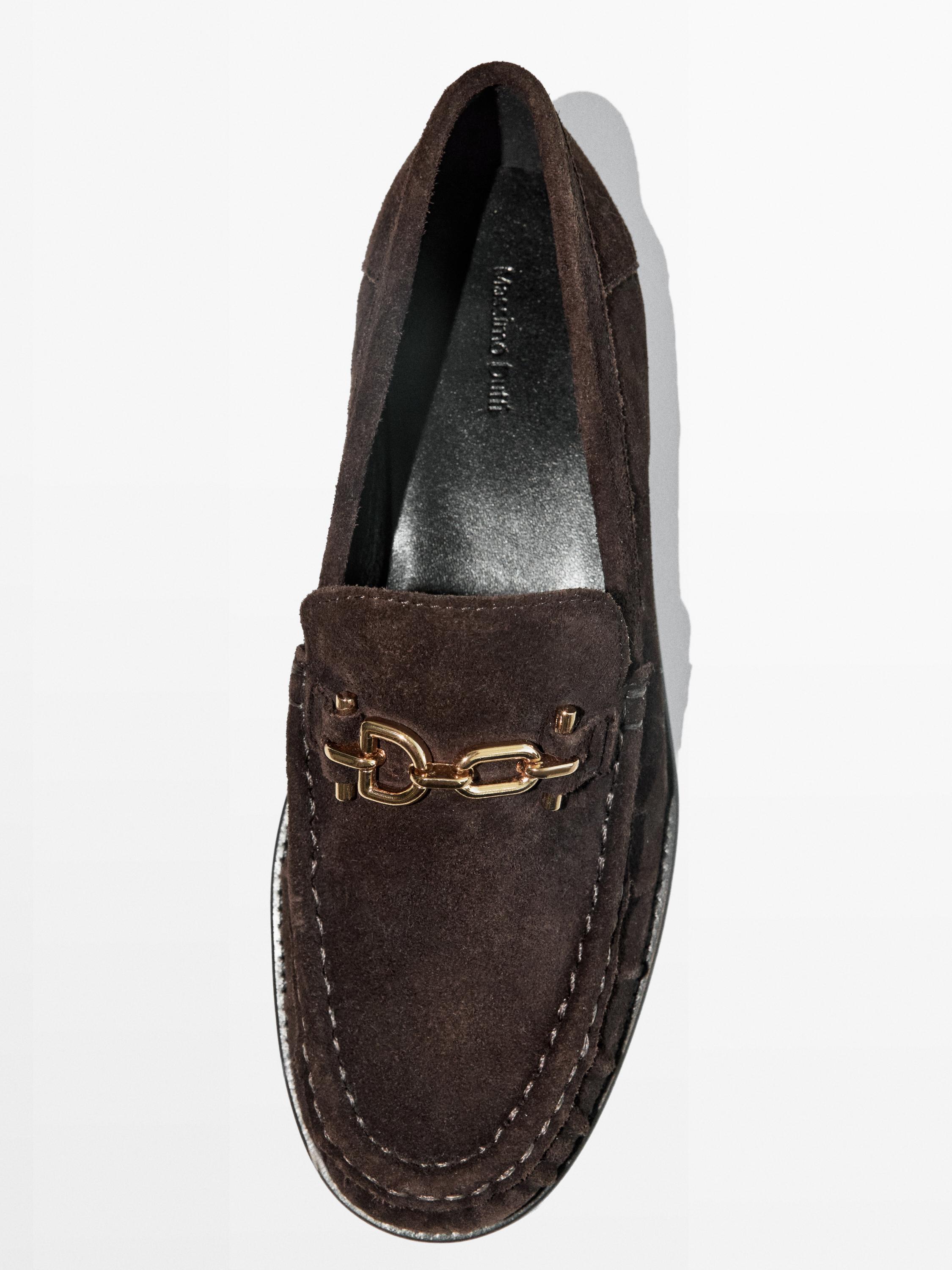Split suede loafers with metal appliqué