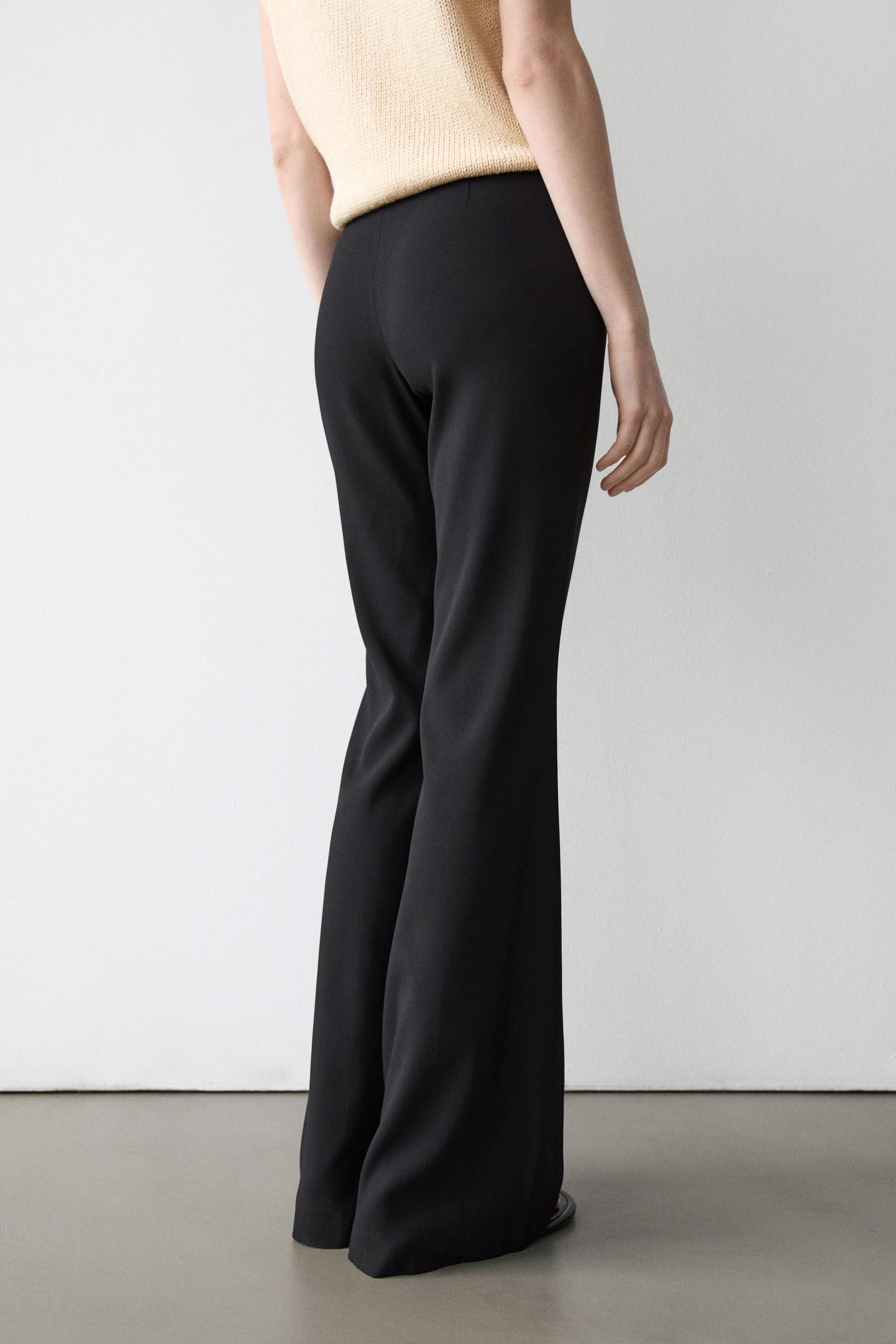 Flared trousers with pocket — BLACK
