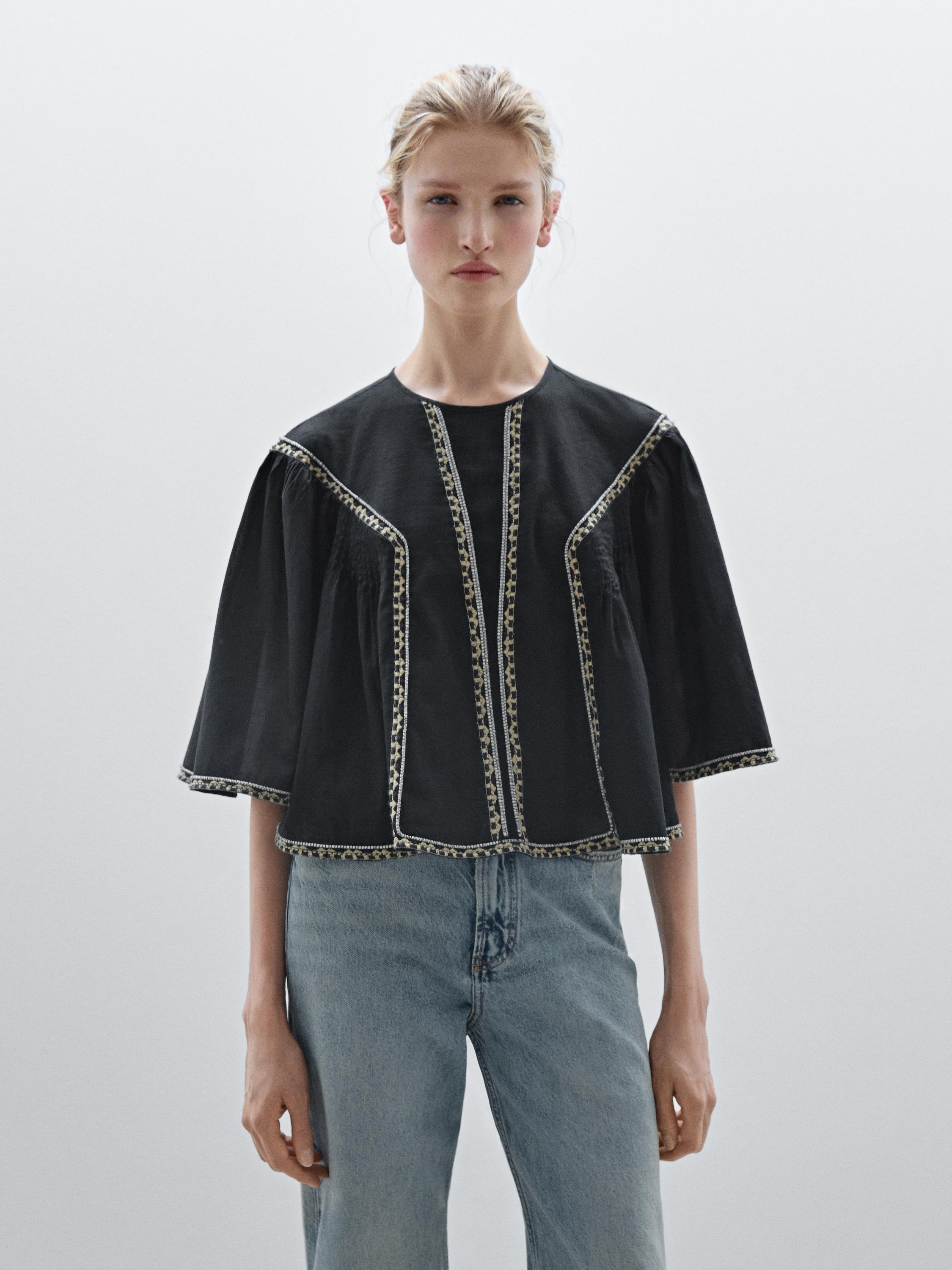 Flowing blouse with embroidered details