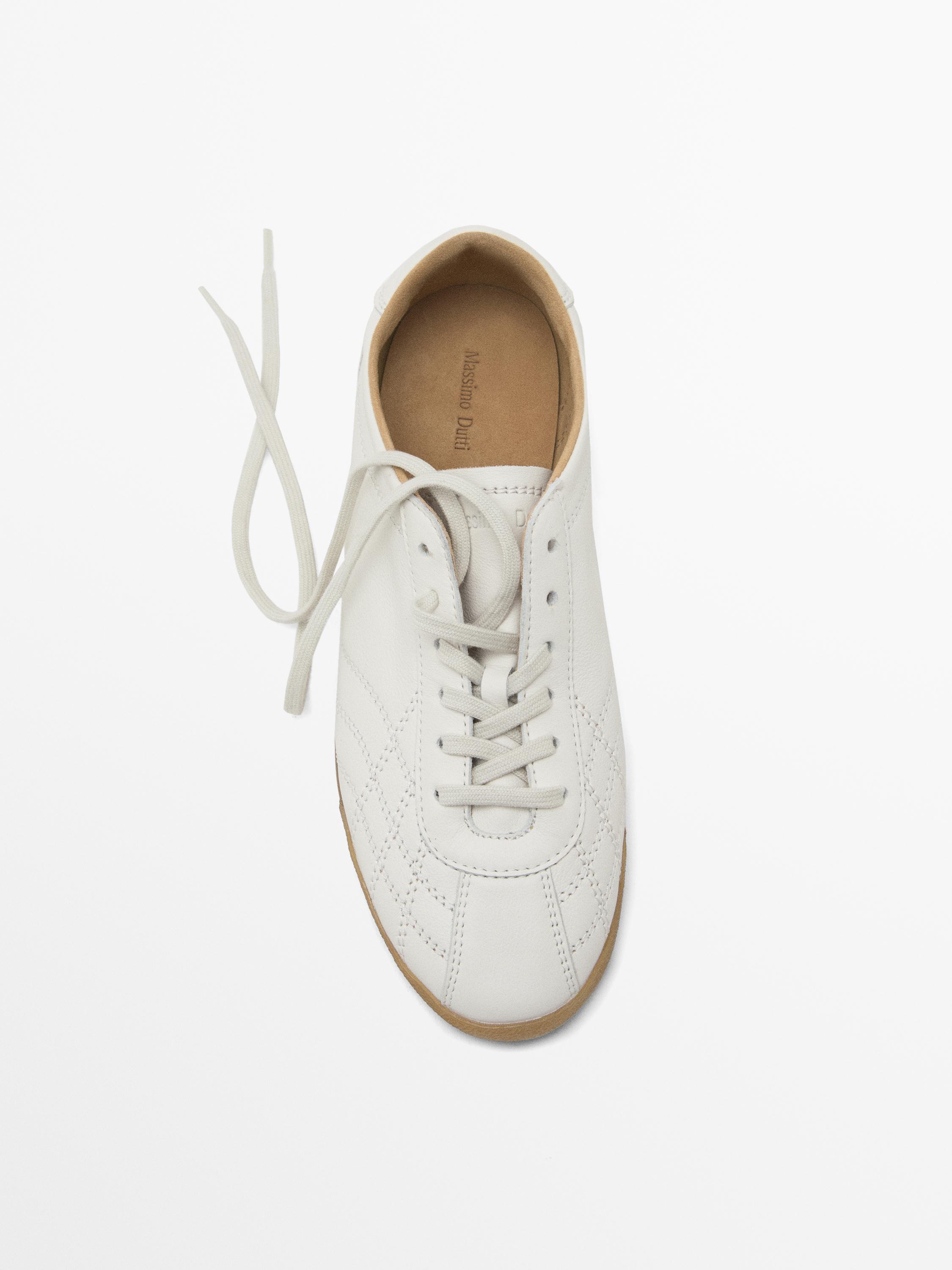 White topstitched trainers