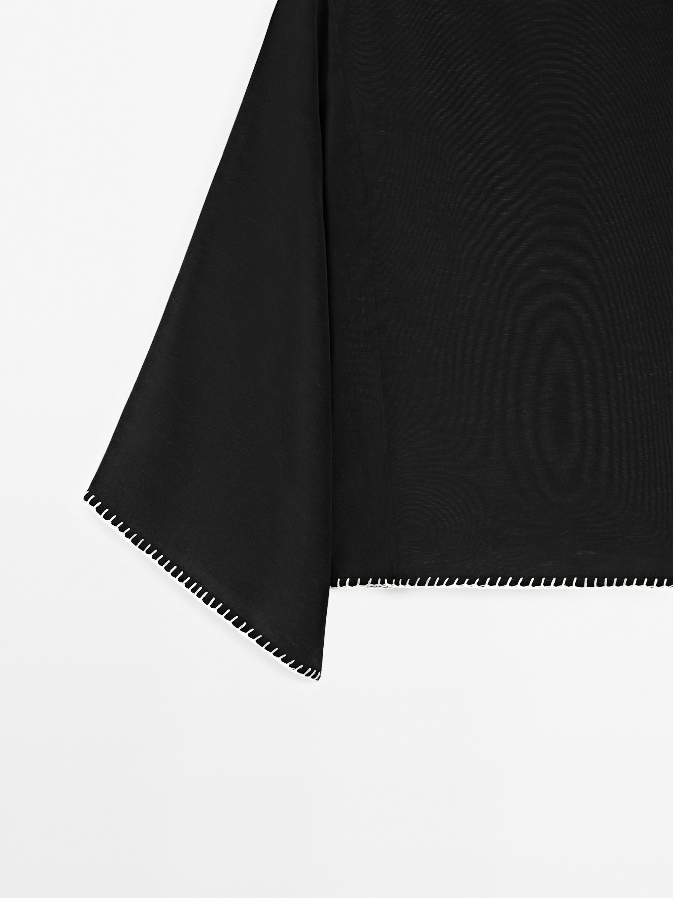 Cape blouse with batwing sleeves