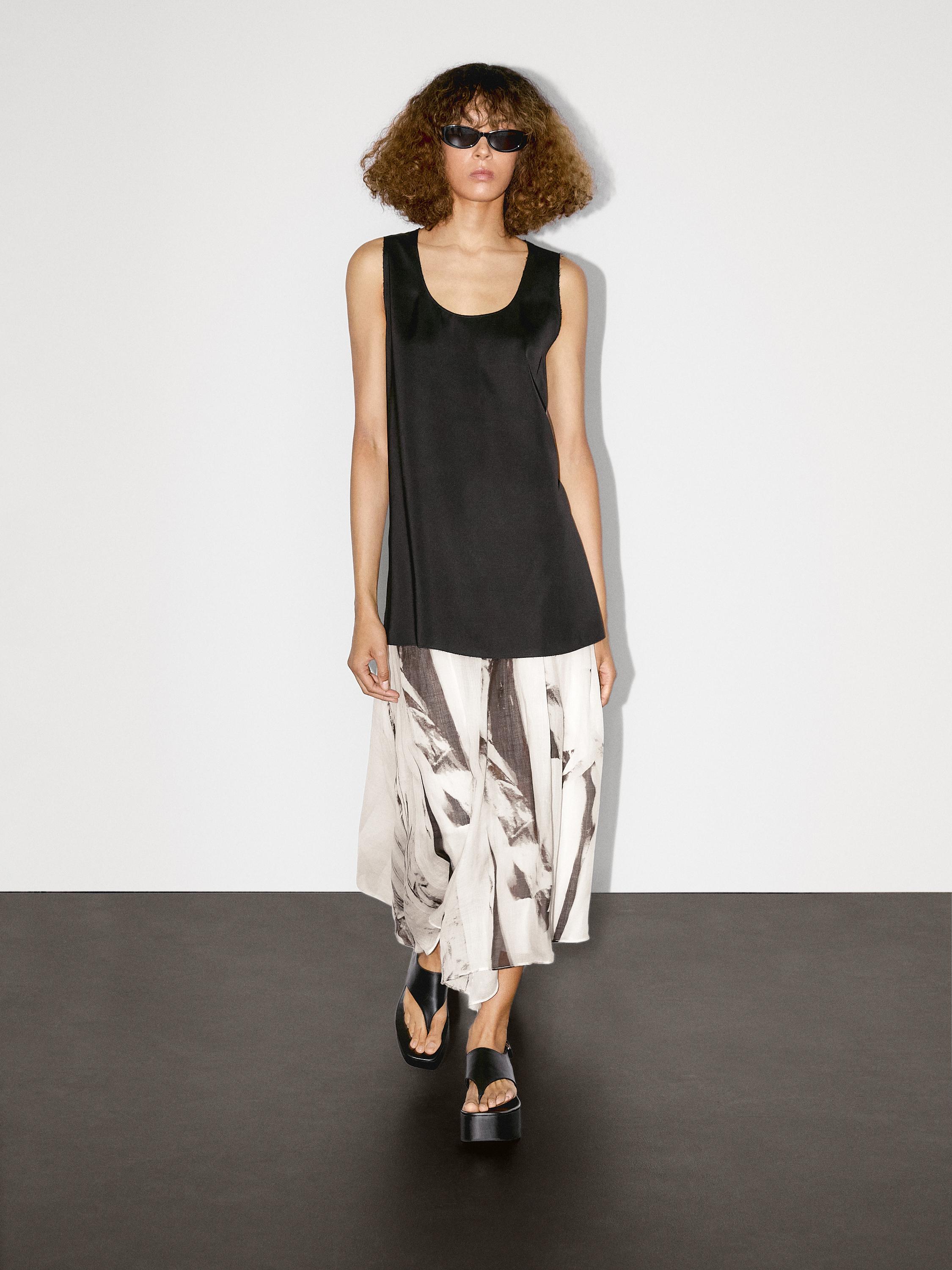 Long sleeveless satin blouse