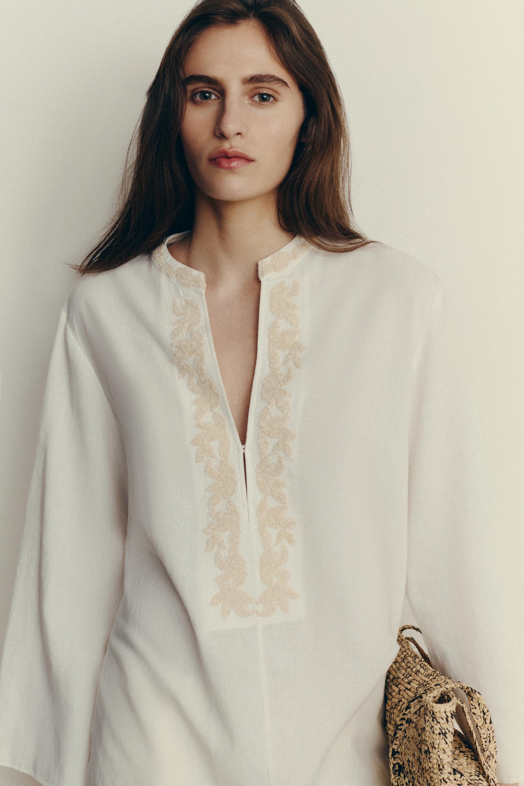 Flowing oversize blouse with stand collar and embroidery — CREAM