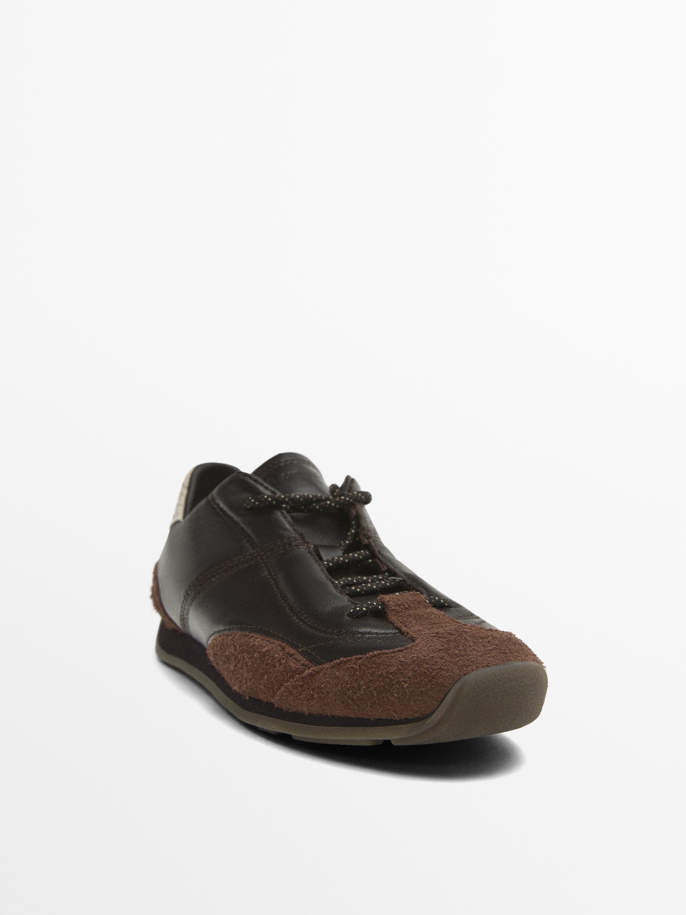 Leather trainers with contrast pieces