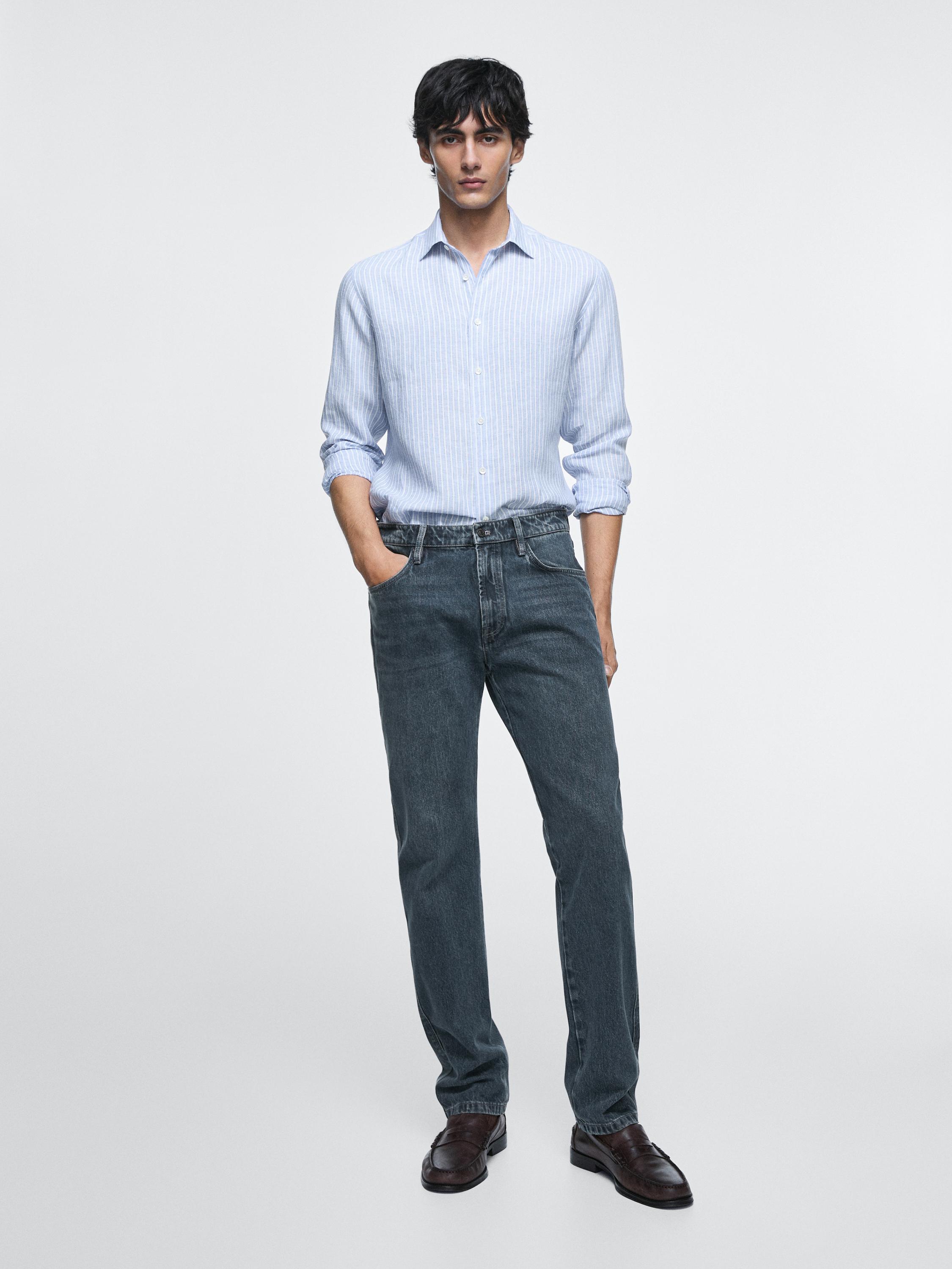 Light blue striped shirt and dark blue tapered fit jeans with side pockets set.