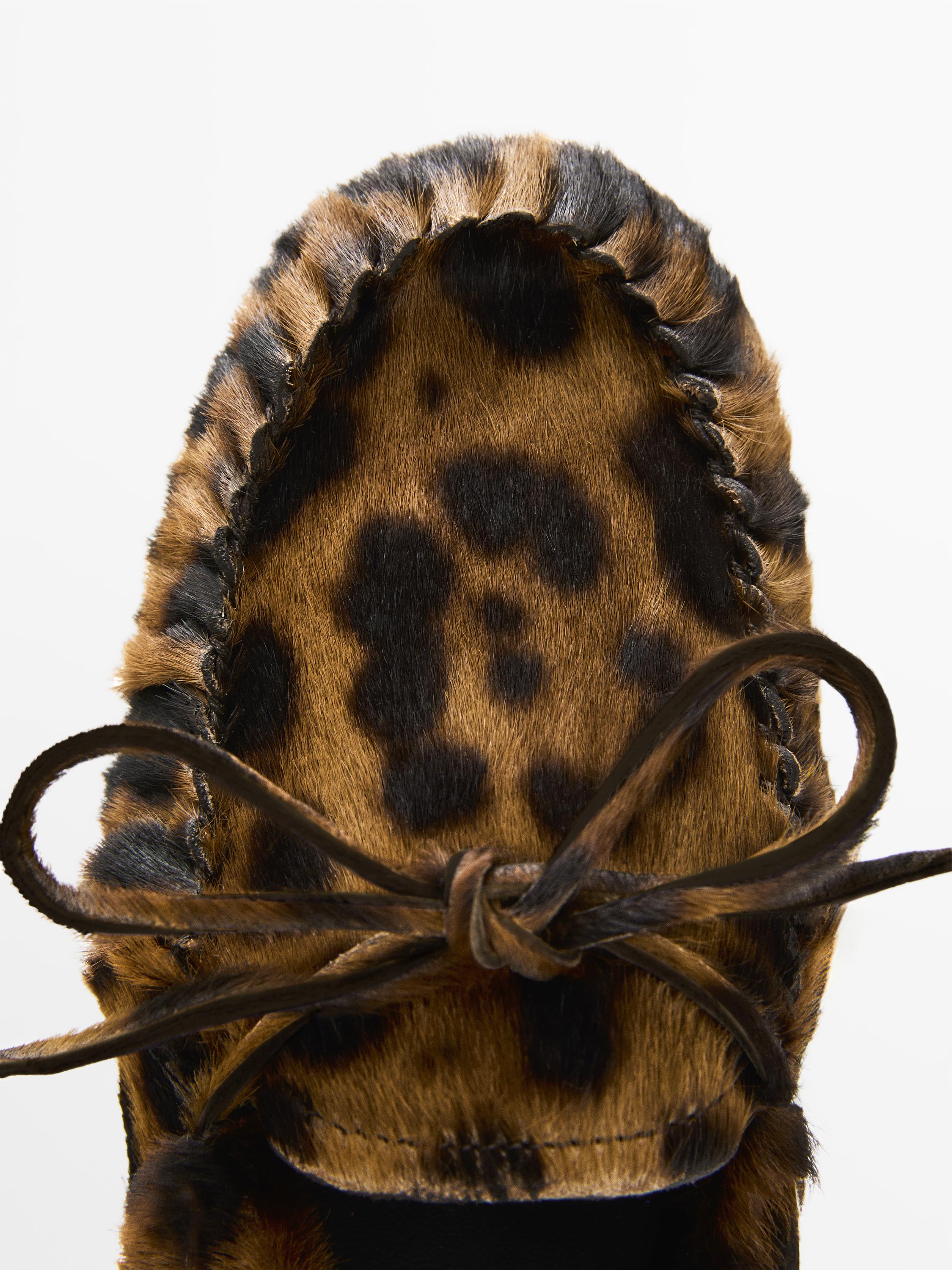 Animal print deck shoes