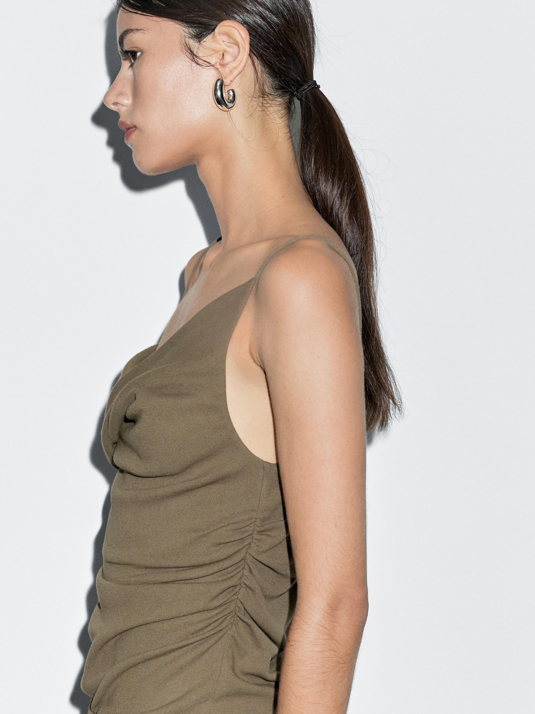100% cotton top with asymmetric neckline