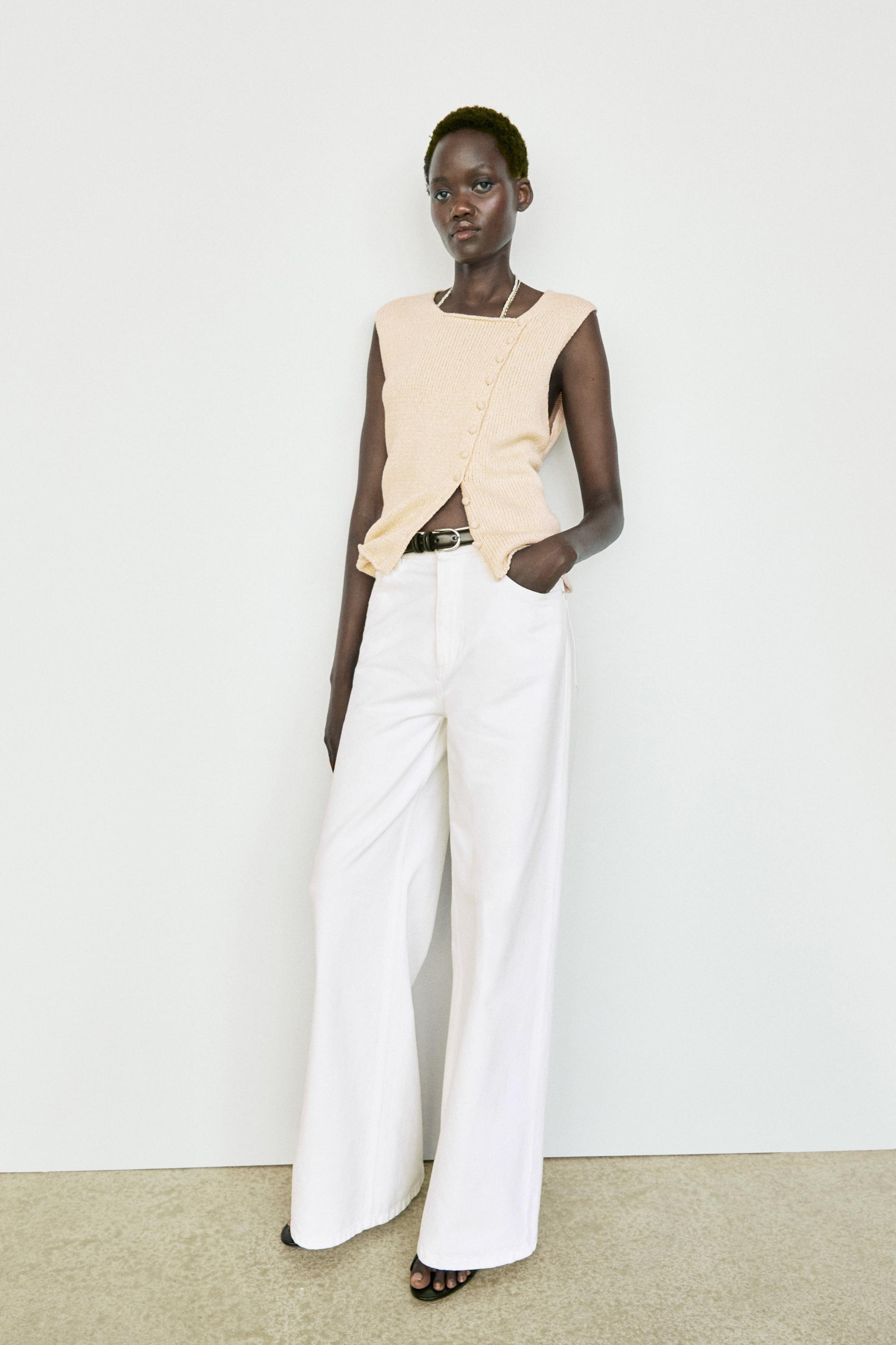 Cotton blend knit top with button detail — CREAM
