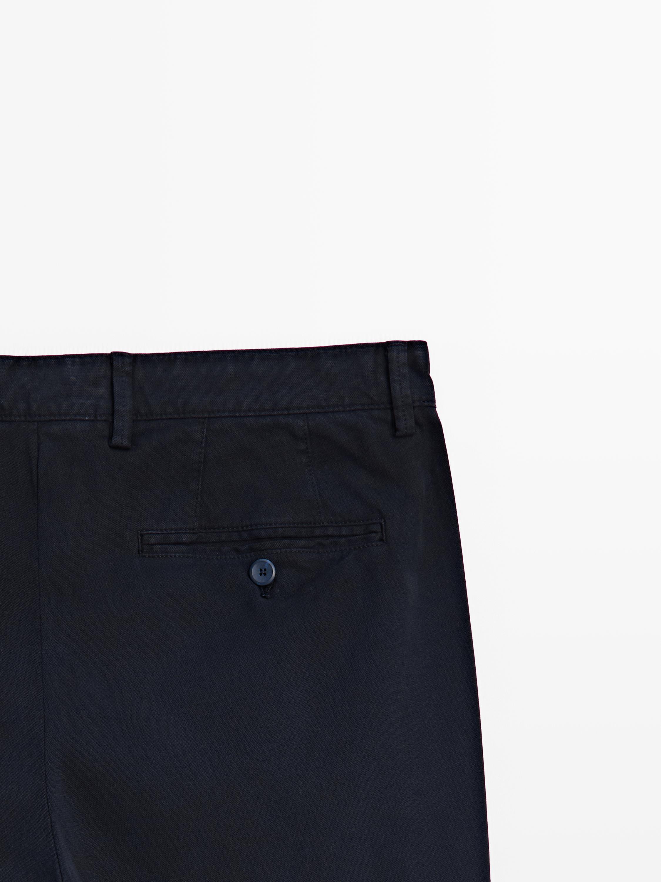 Slim-fit micro-textured trousers — NAVY BLUE