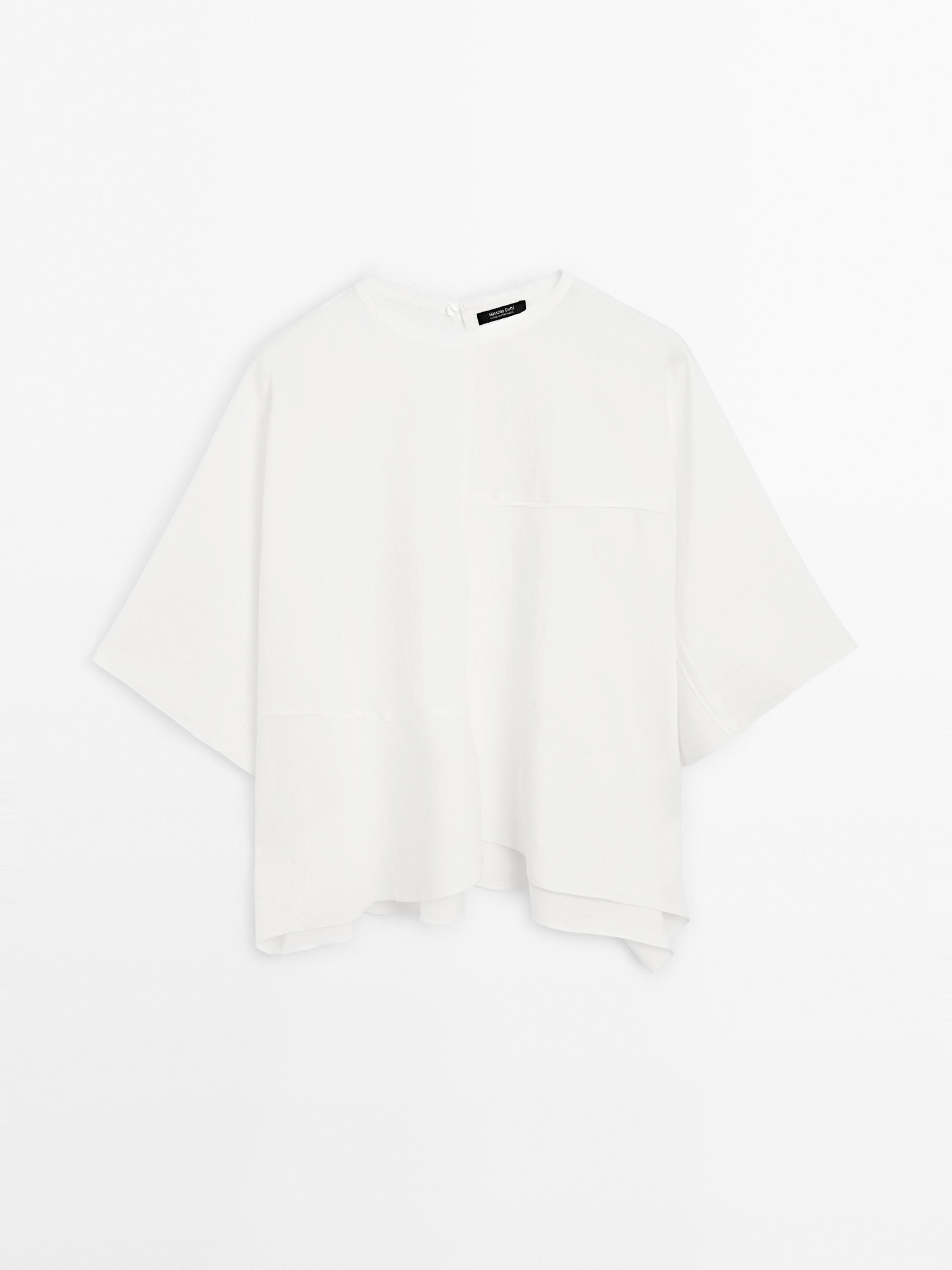 Short cape with seam details